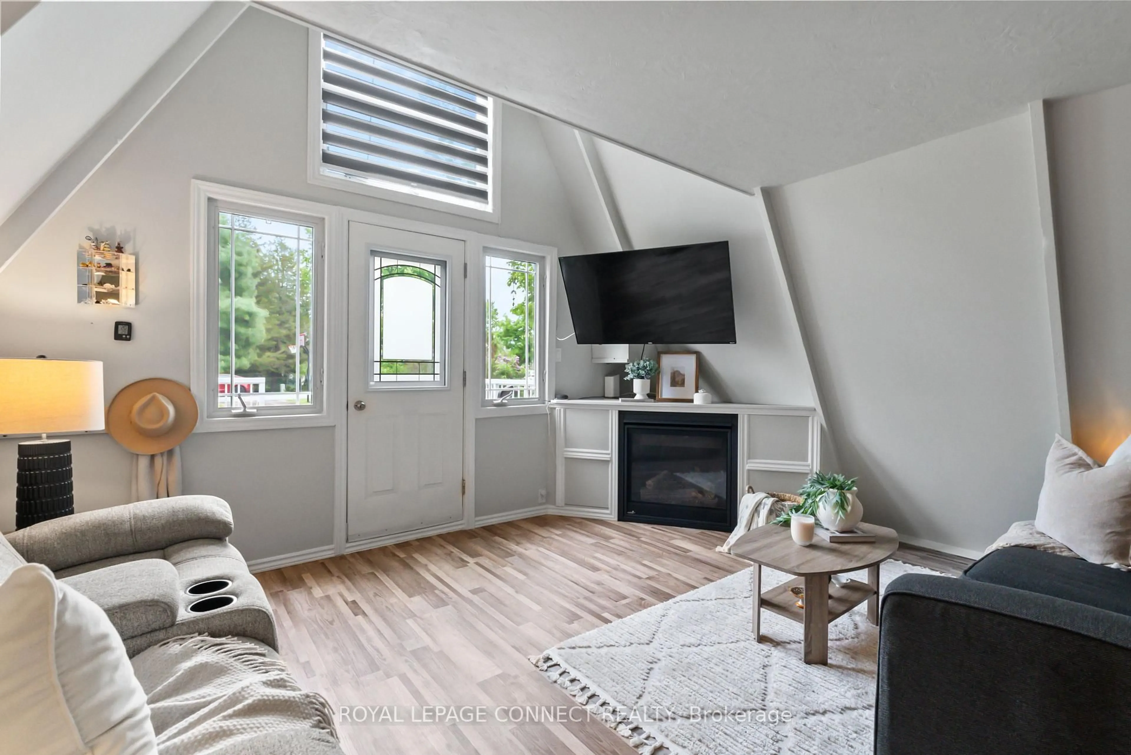 Living room with furniture, wood/laminate floor for 31 Falls Bay Rd, Kawartha Lakes Ontario K0M 1A0