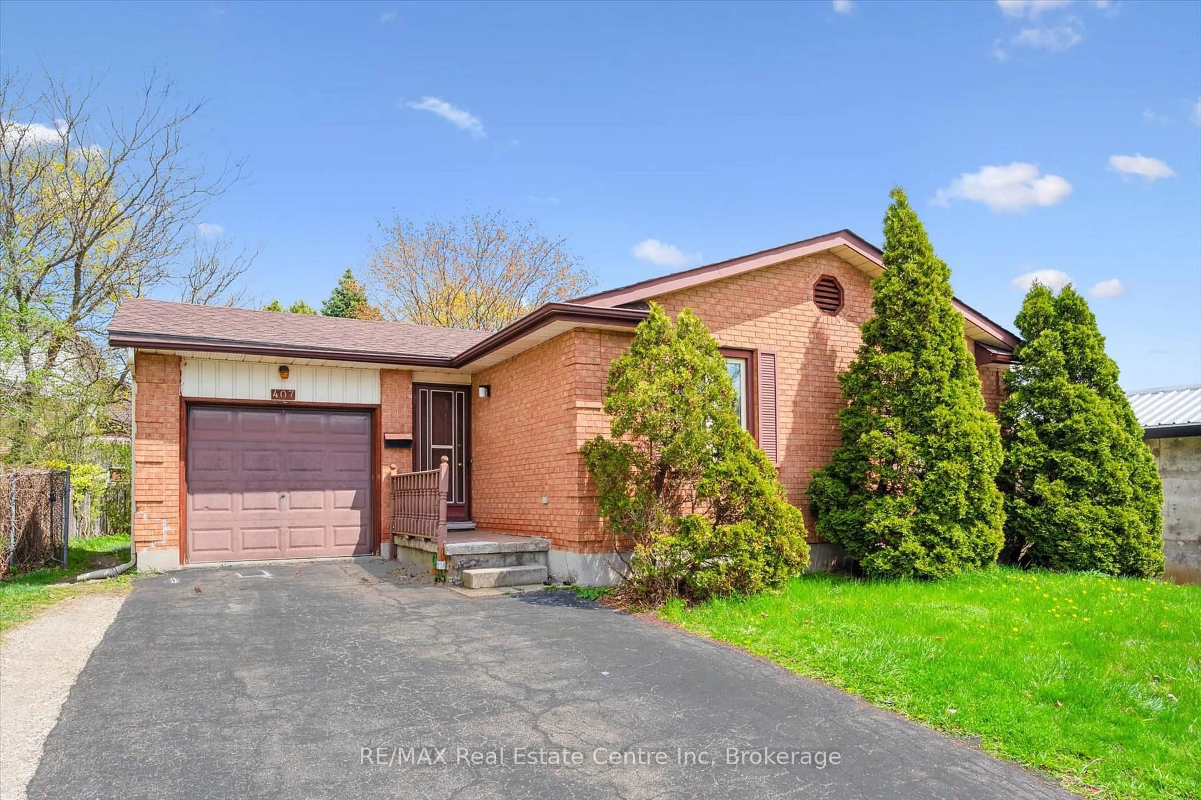 Home with brick exterior material, street for 407 IRONWOOD Rd, Guelph Ontario N1G 3R2