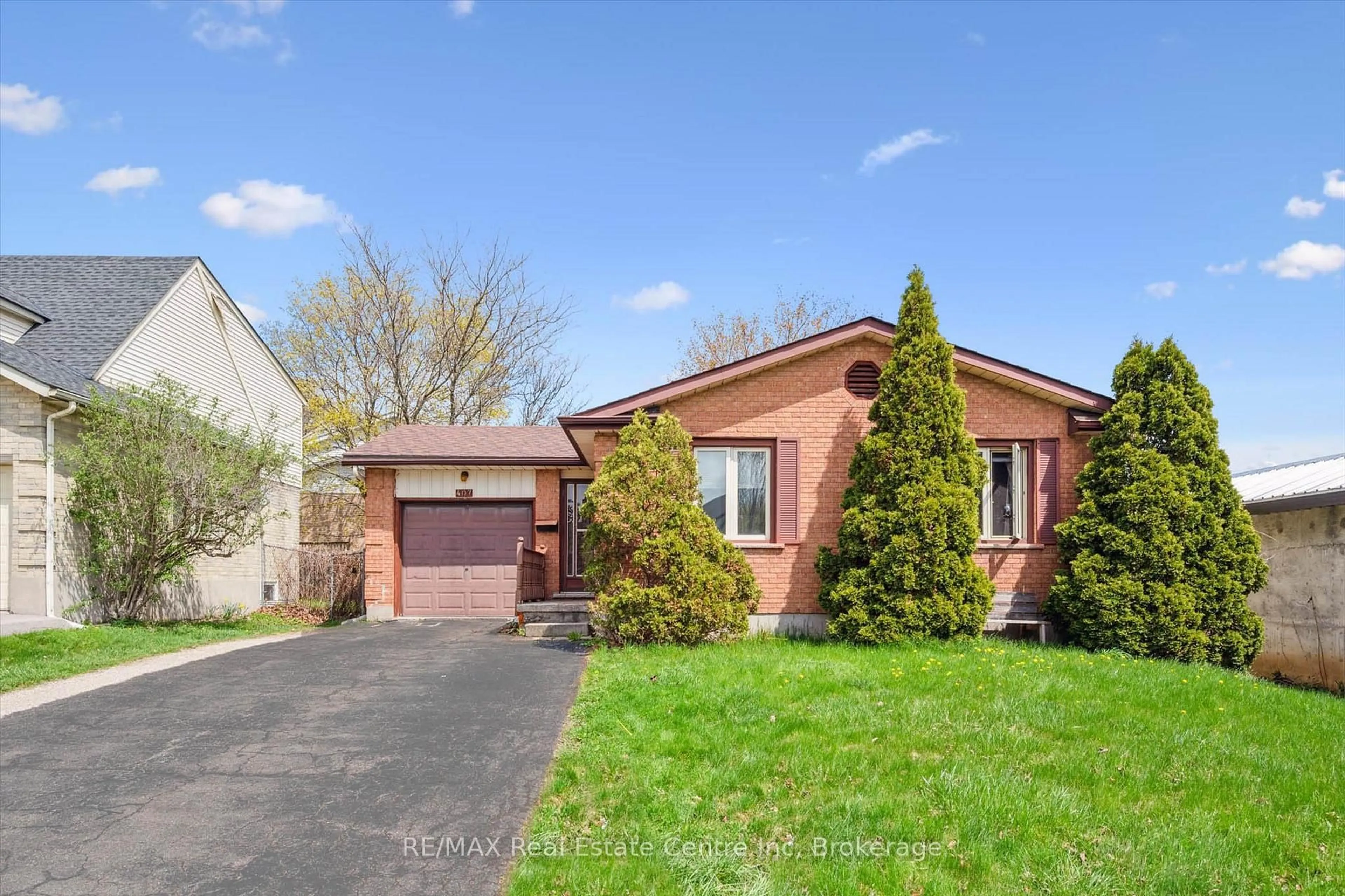Home with brick exterior material, street for 407 IRONWOOD Rd, Guelph Ontario N1G 3R2