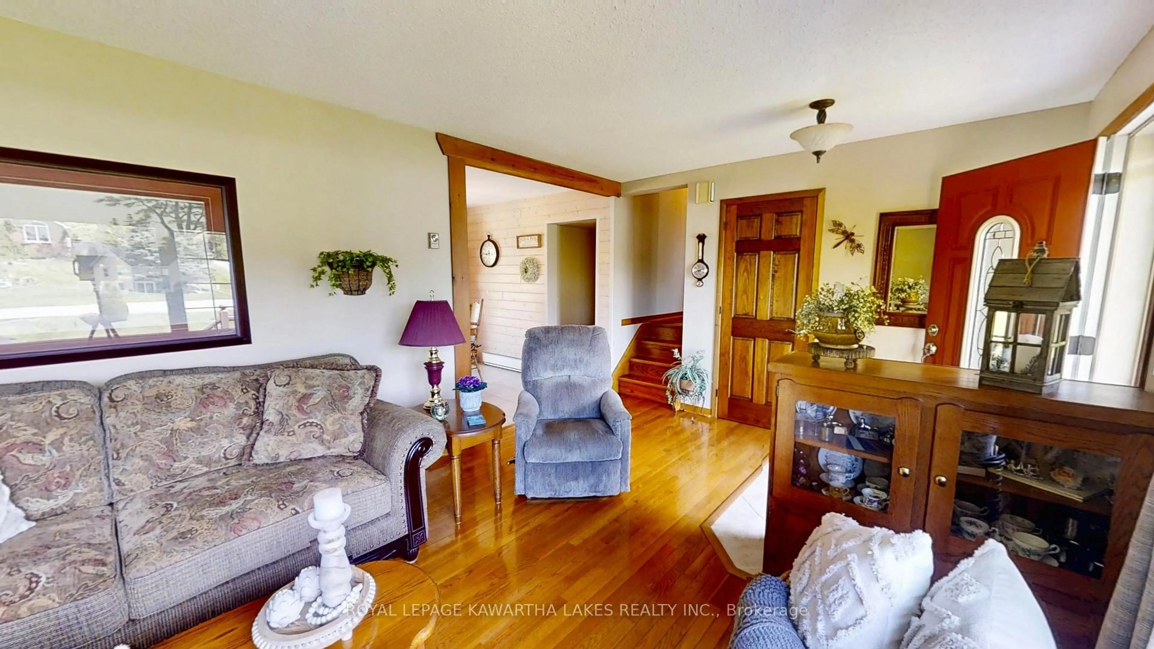 Living room with furniture, wood/laminate floor for 30 Grant Dr, Kawartha Lakes Ontario K0M 2M0