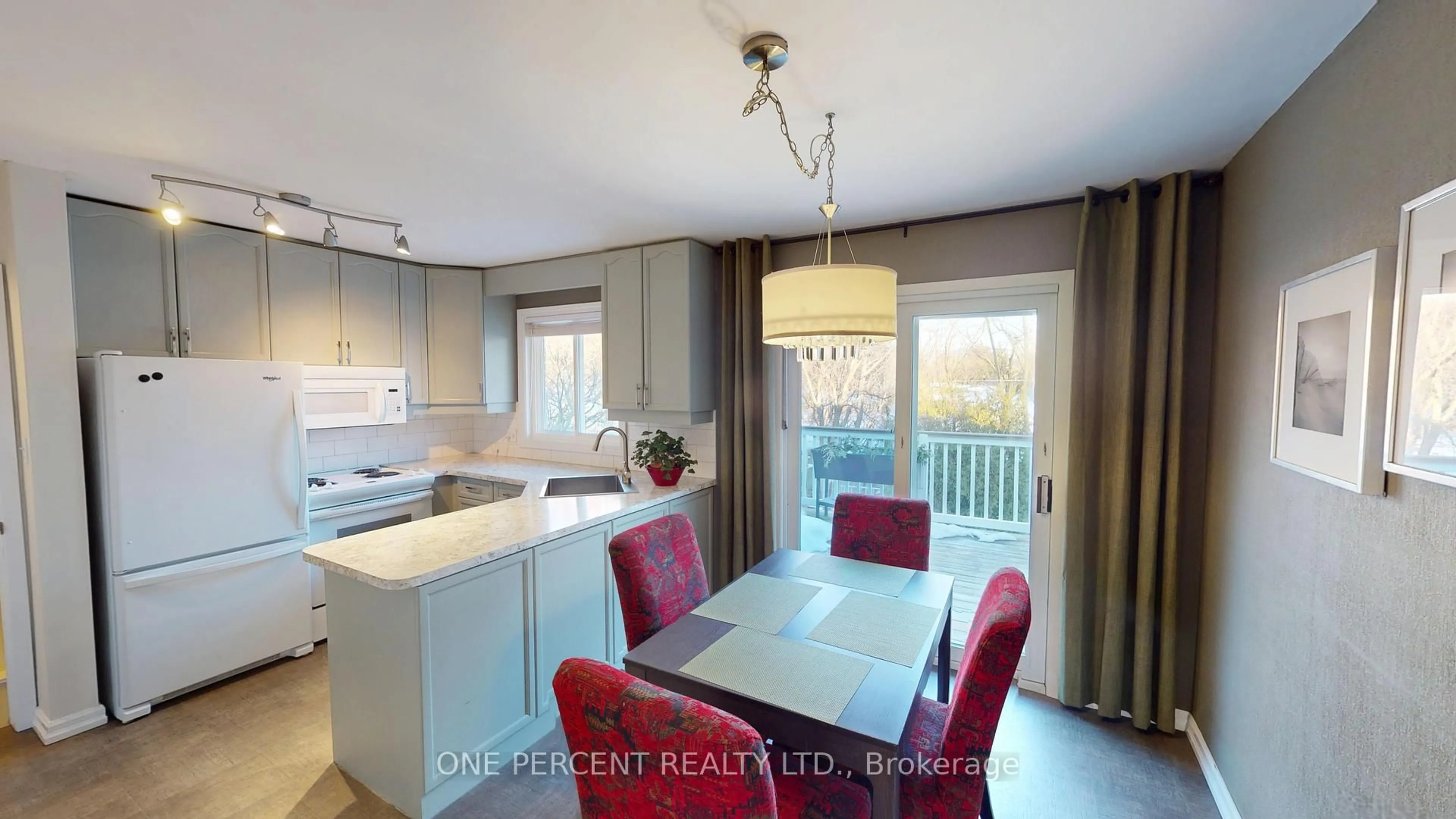 Open concept kitchen, wood/laminate floor for 38 Strathcona Dr, St. Catharines Ontario L2M 2A9