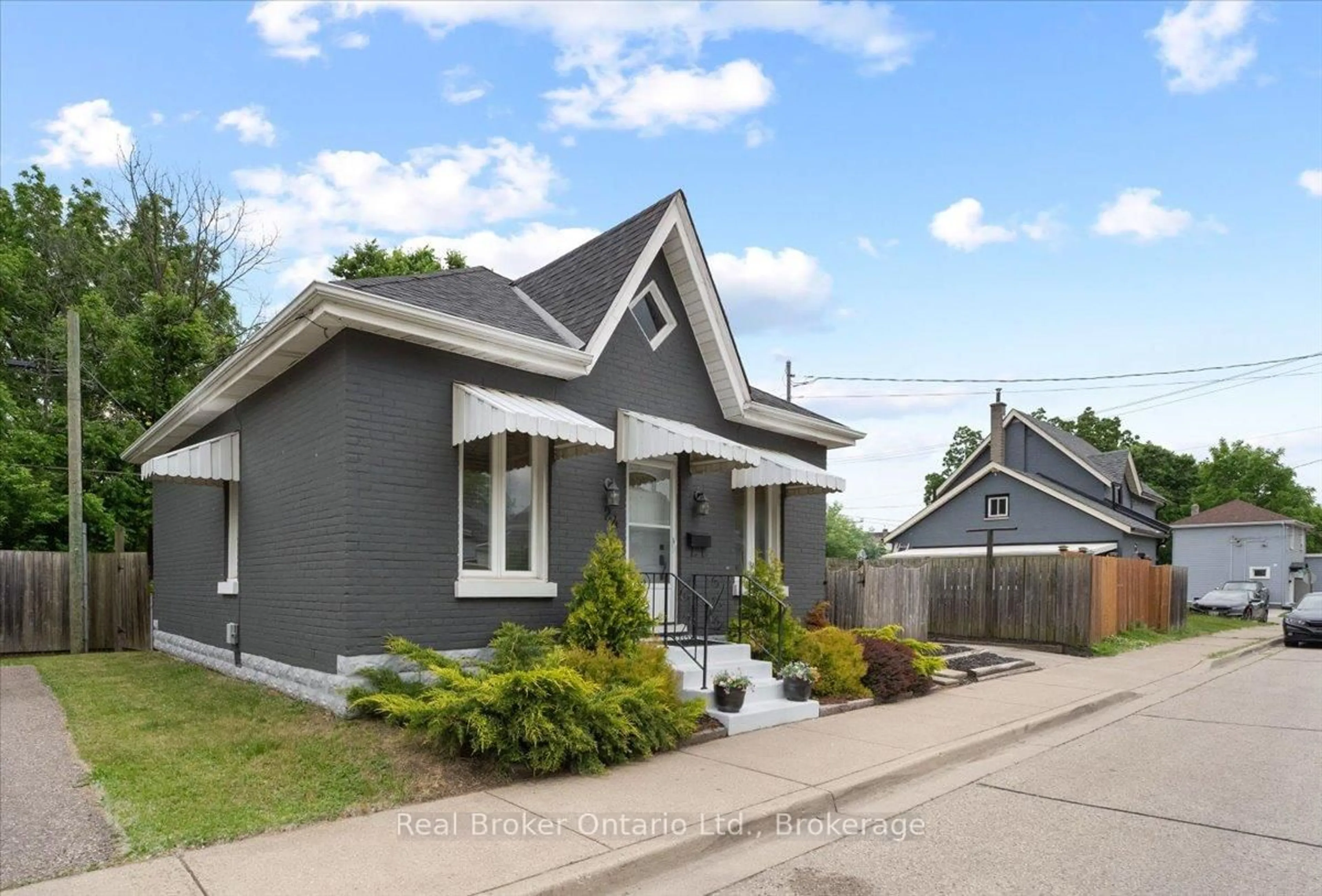 Home with brick exterior material, street for 24 Rose Ave, Brant Ontario N3S 2L9