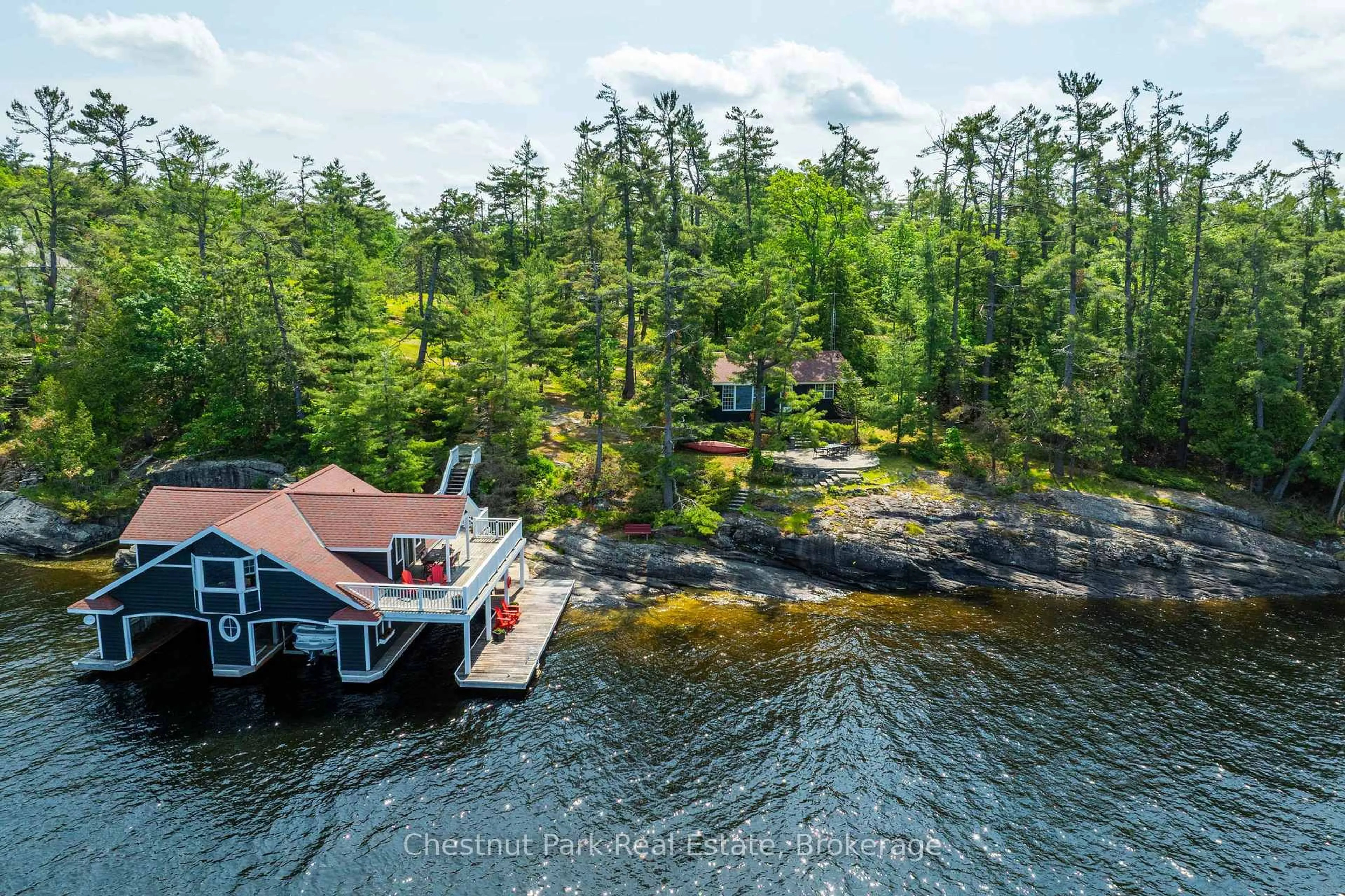 A pic from outside/outdoor area/front of a property/back of a property/a pic from drone, water/lake/river/ocean view for 1216 Ennis Bay Rd, Bracebridge Ontario P1L 1T8