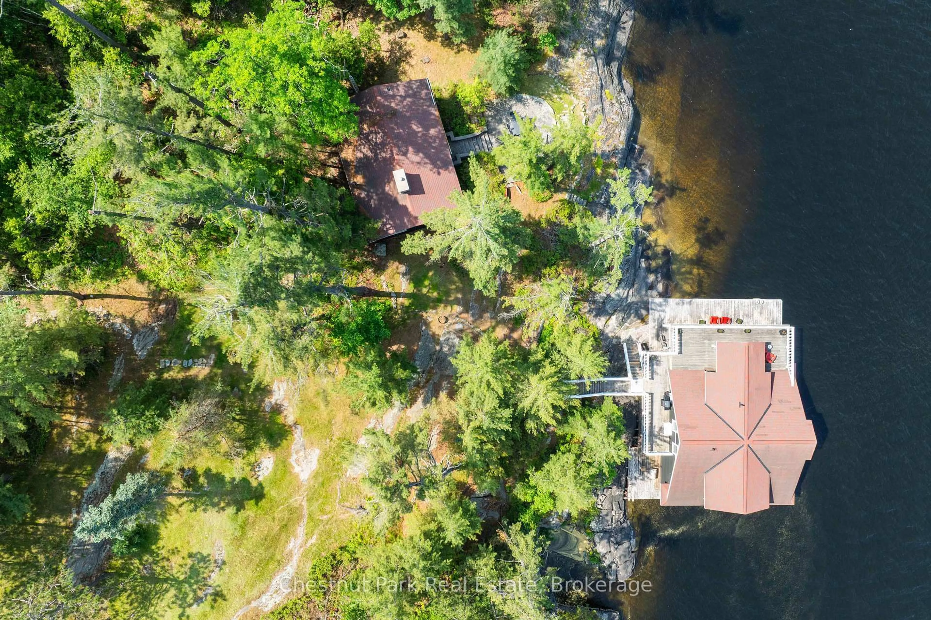A pic from outside/outdoor area/front of a property/back of a property/a pic from drone, water/lake/river/ocean view for 1216 Ennis Bay Rd, Bracebridge Ontario P1L 1T8