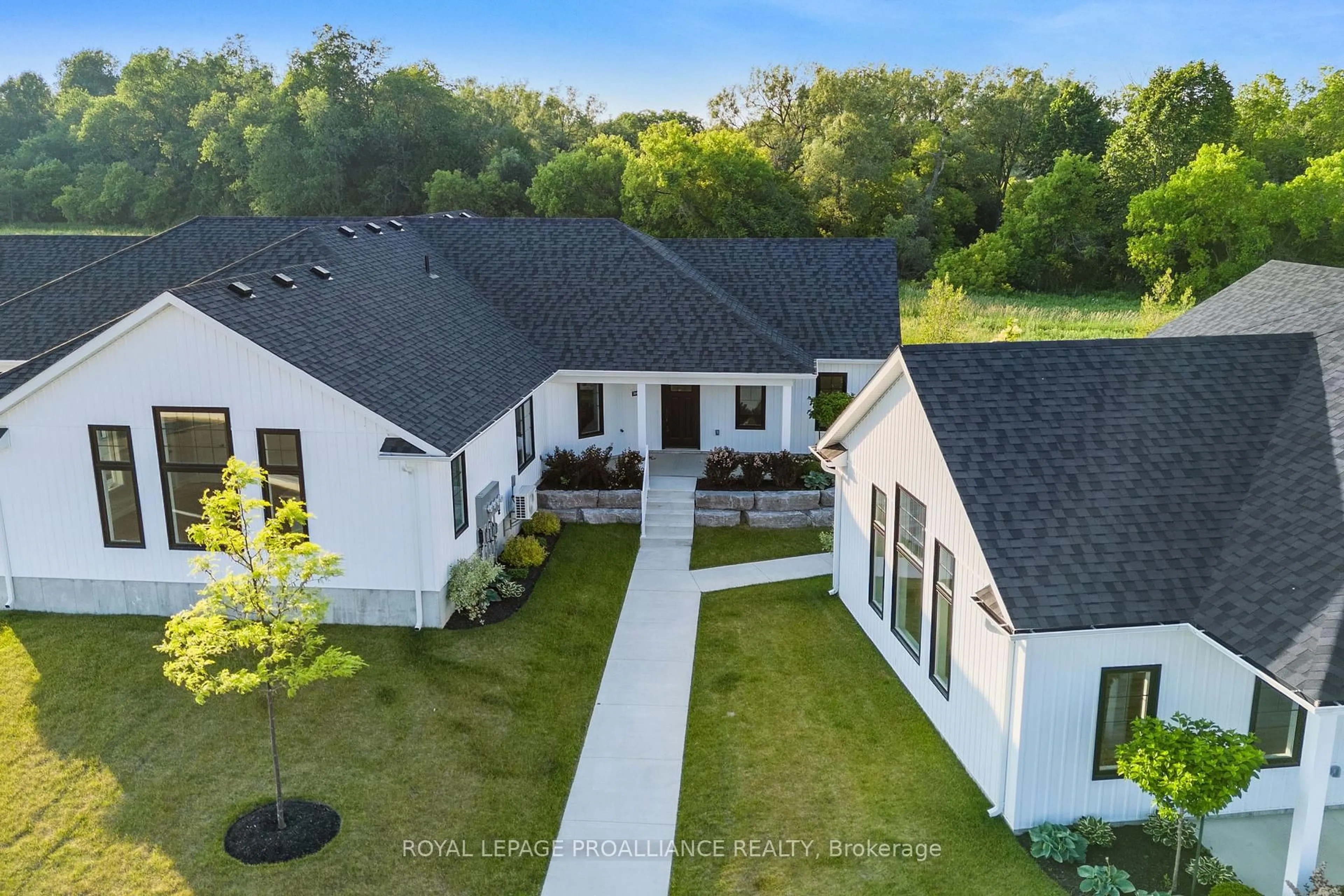 A pic from outside/outdoor area/front of a property/back of a property/a pic from drone, unknown for 14 Meadowcreek Dr #304, Brighton Ontario K0K 1H0