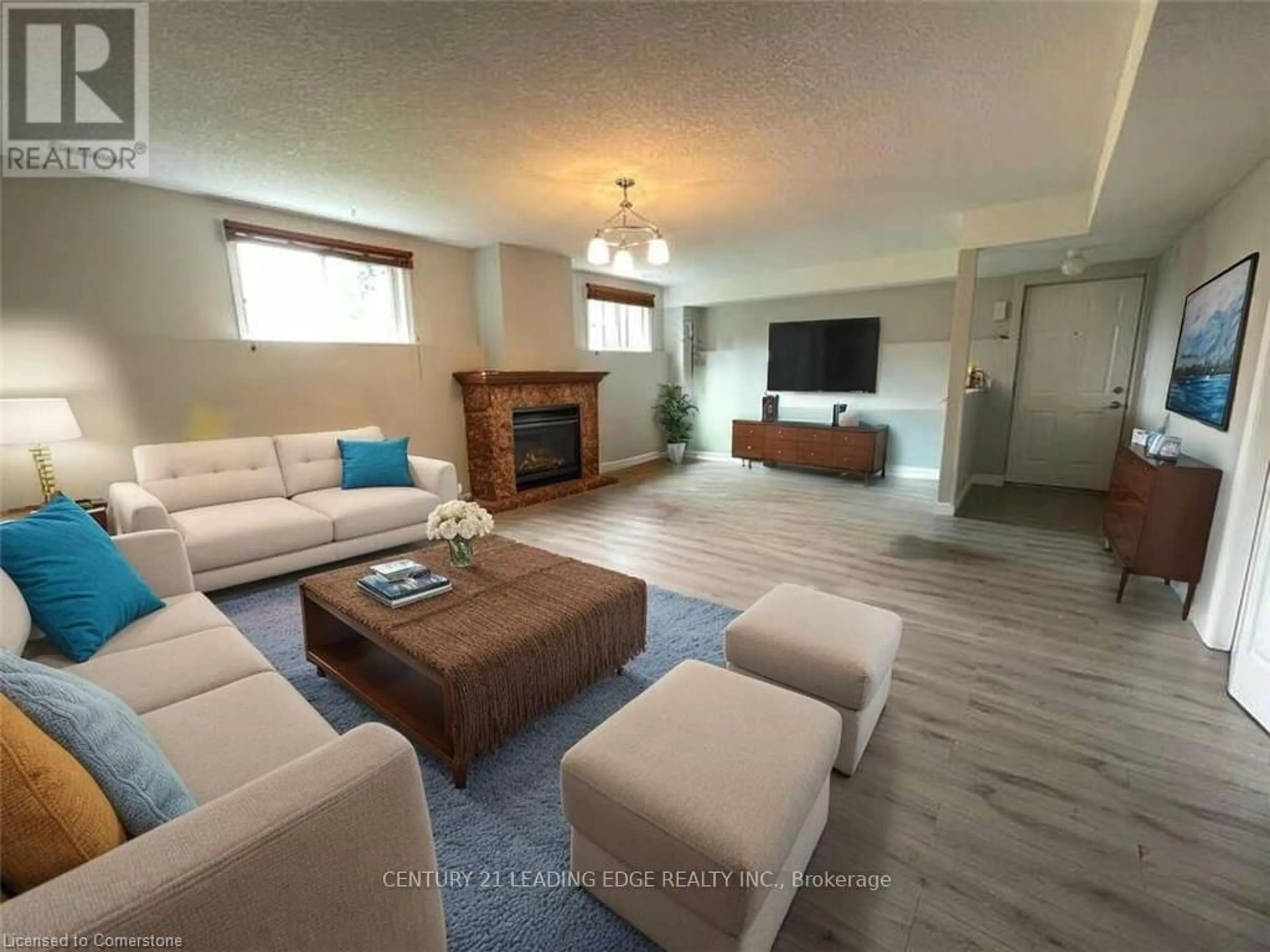 Living room with furniture, wood/laminate floor for 30 Musselman Cres, Woolwich Ontario N0B 1N0