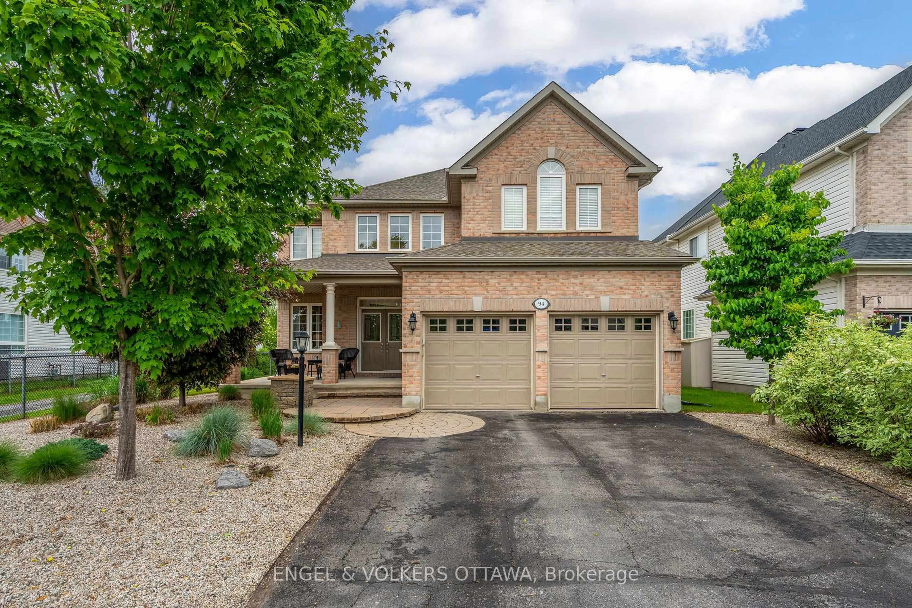Home with brick exterior material, street for 94 Riverstone Dr, Ottawa Ontario K2J 5E3
