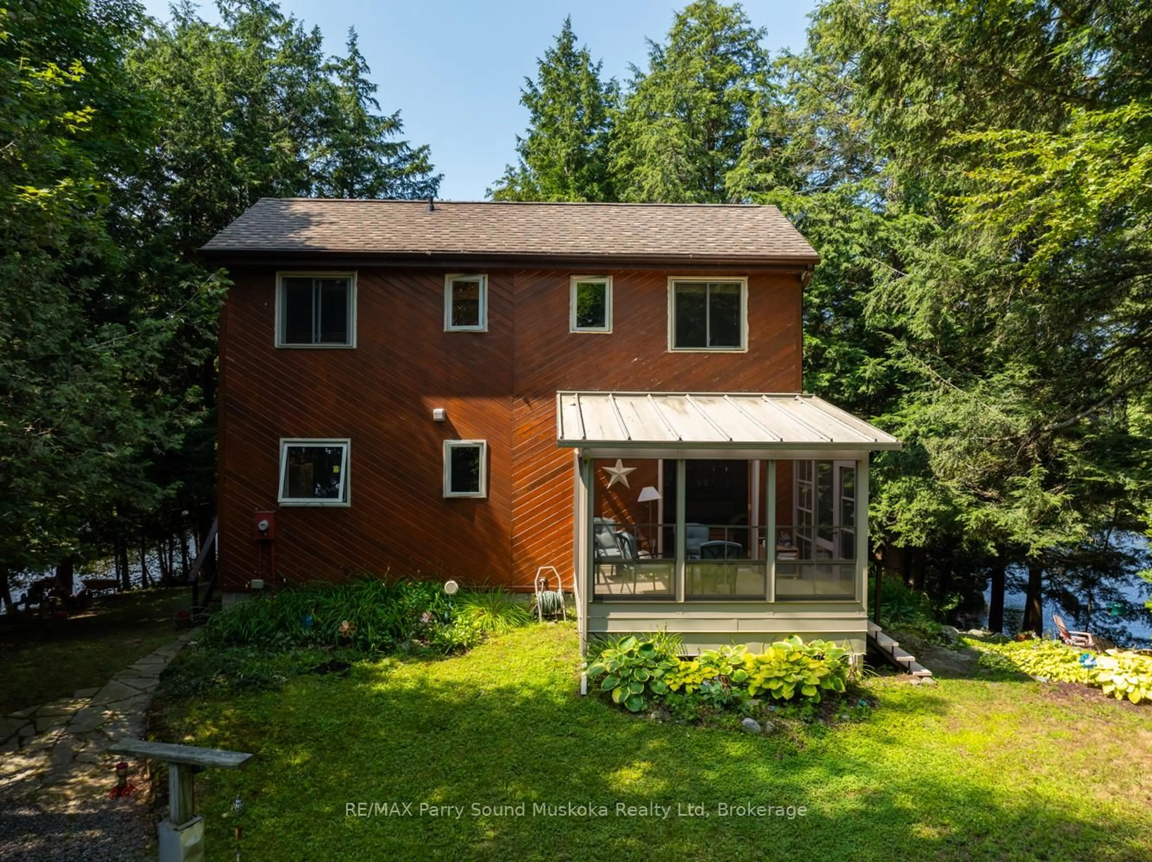A pic from outside/outdoor area/front of a property/back of a property/a pic from drone, forest/trees view for 18 MEHARG Dr, McKellar Ontario P2A 0B5