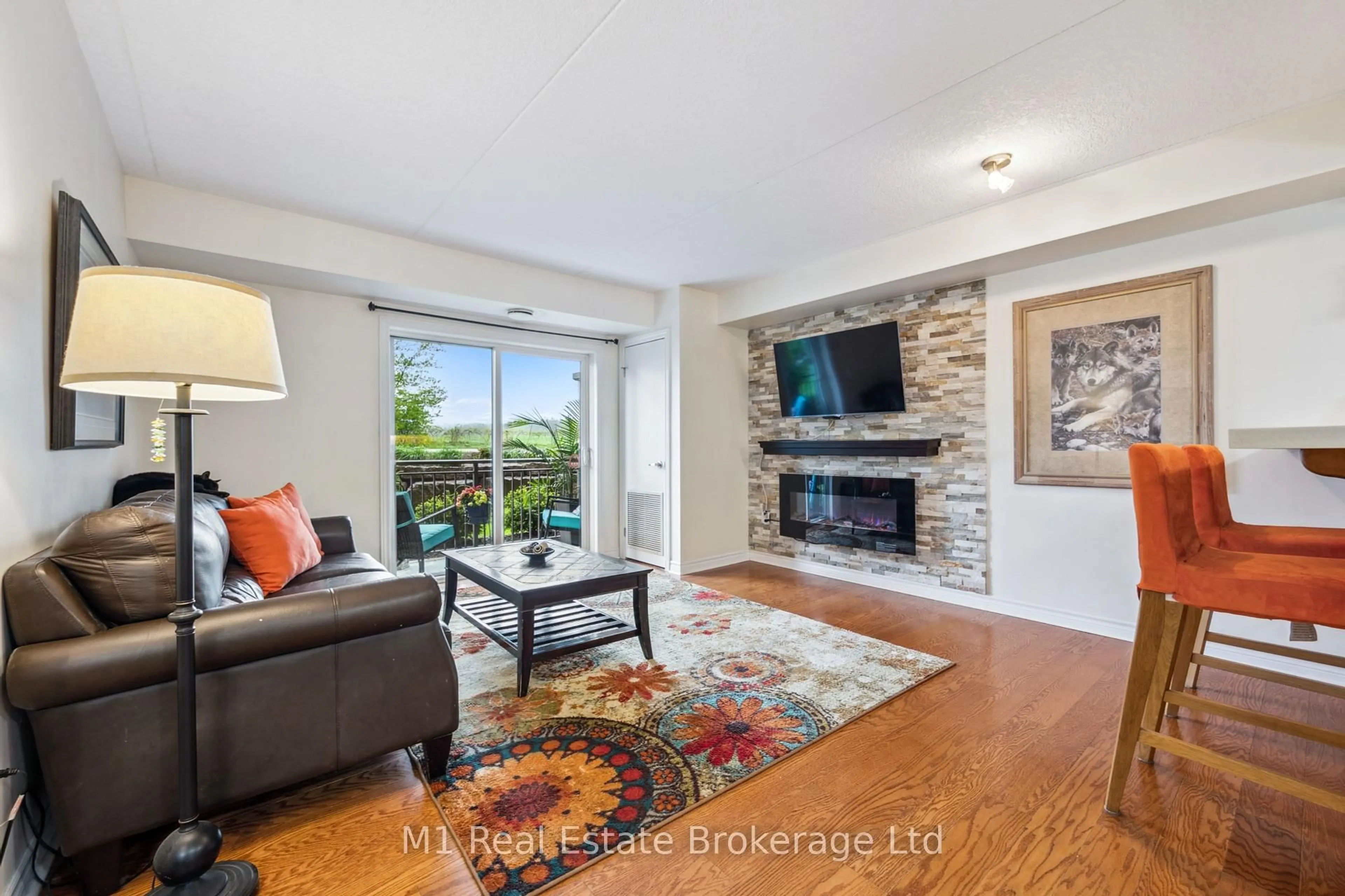 Living room with furniture, unknown for 19 Waterford Dr #105, Guelph Ontario N1L 0G8