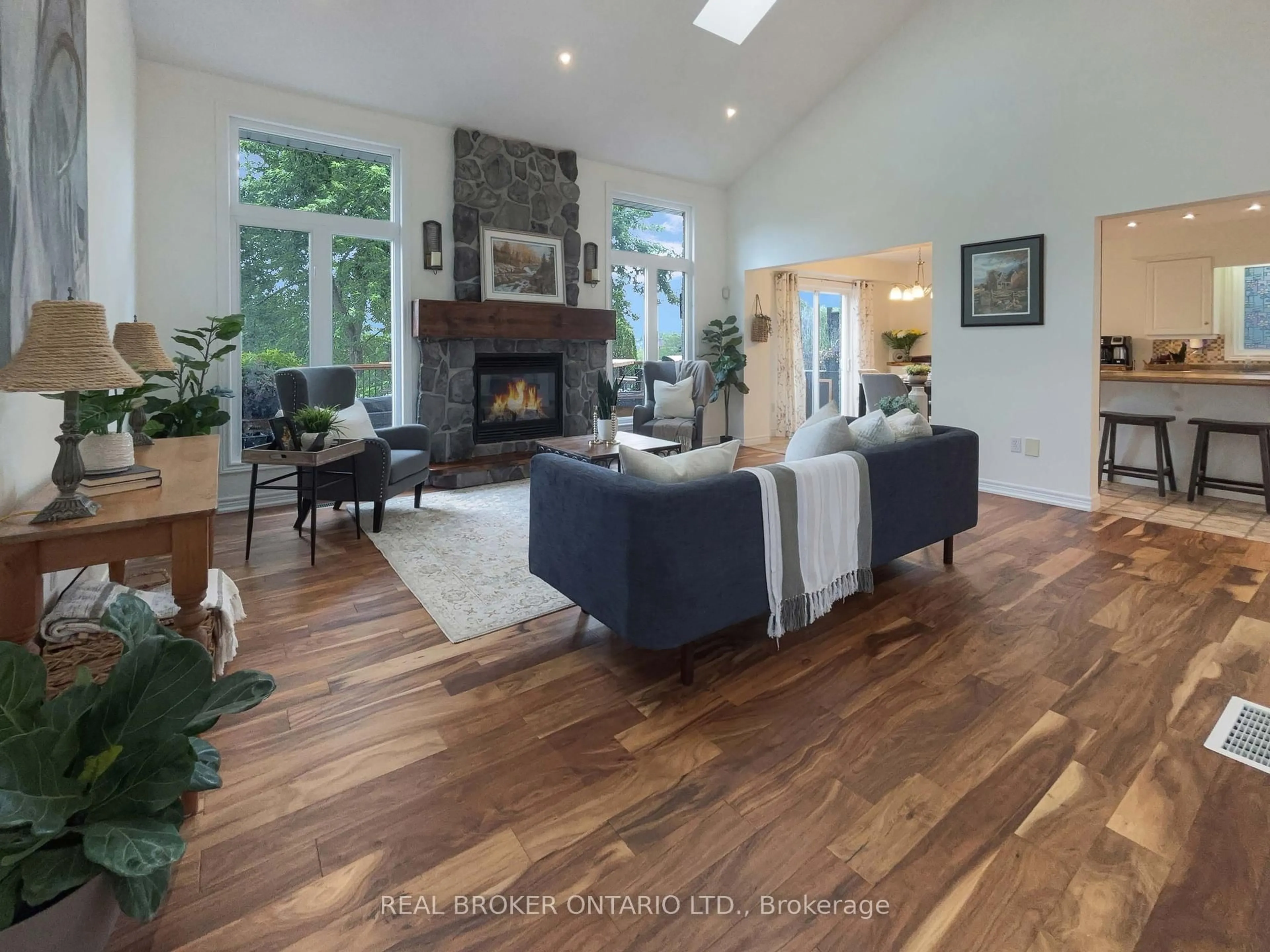 Living room with furniture, wood/laminate floor for 18 Bricker Crt, Brantford Ontario N3T 6R7