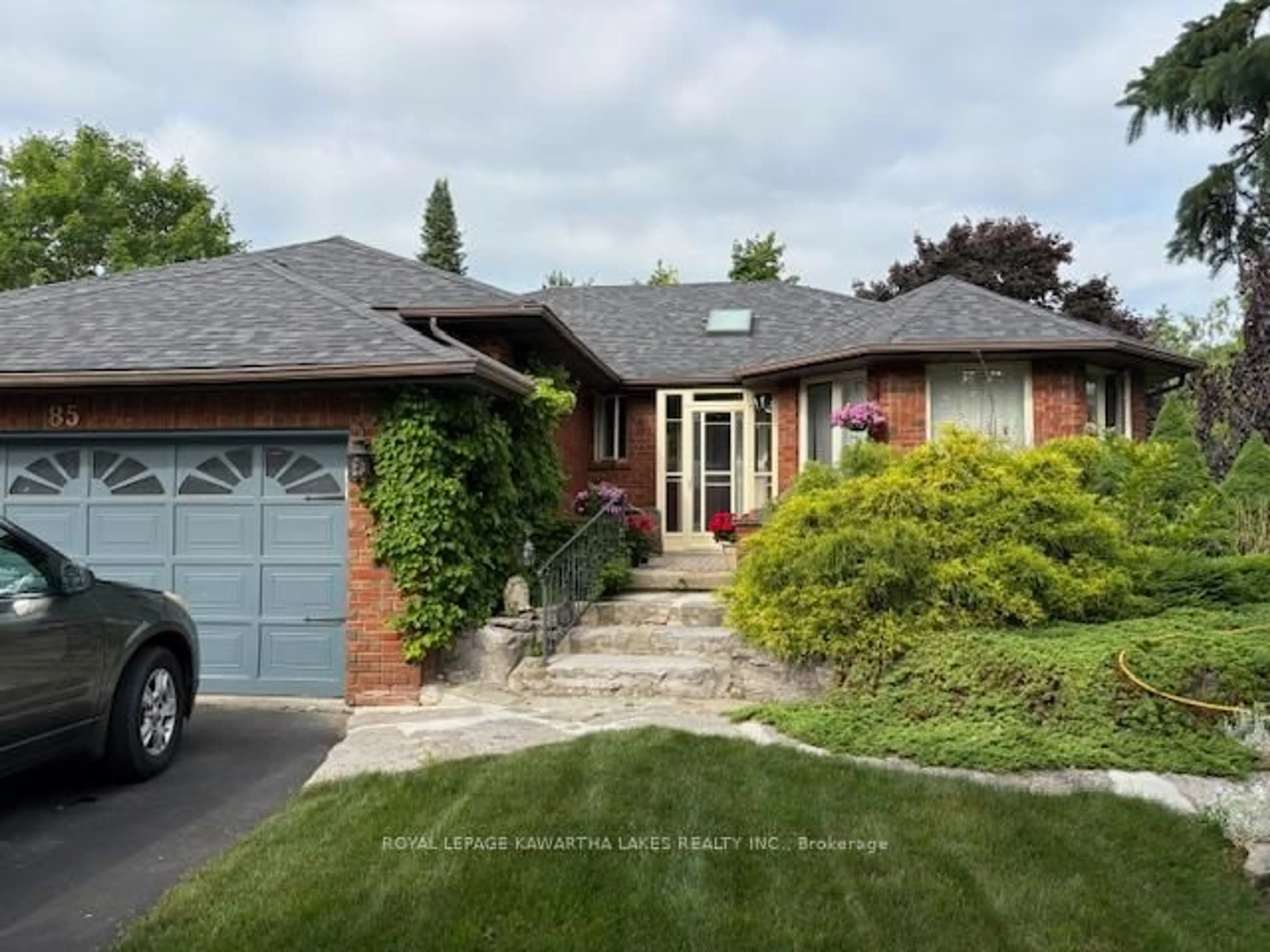 Home with brick exterior material, street for 85 Navigators Tr, Kawartha Lakes Ontario K0M 1A0