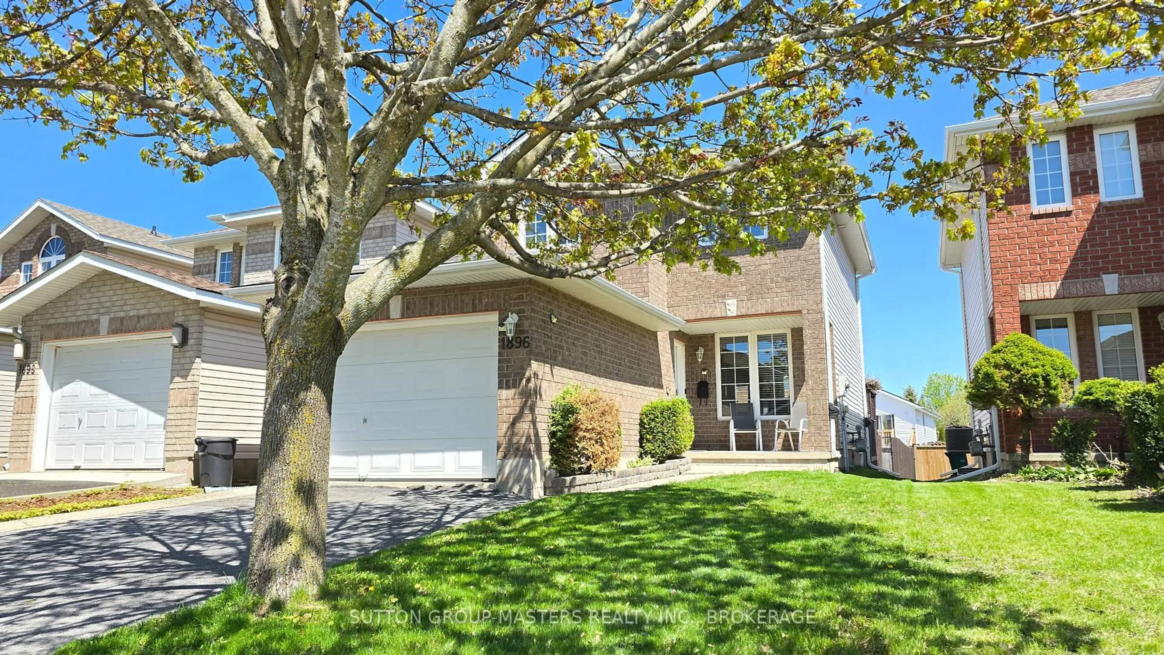 Home with vinyl exterior material, street for 1896 Berrywood Cres, Kingston Ontario K7P 3G4