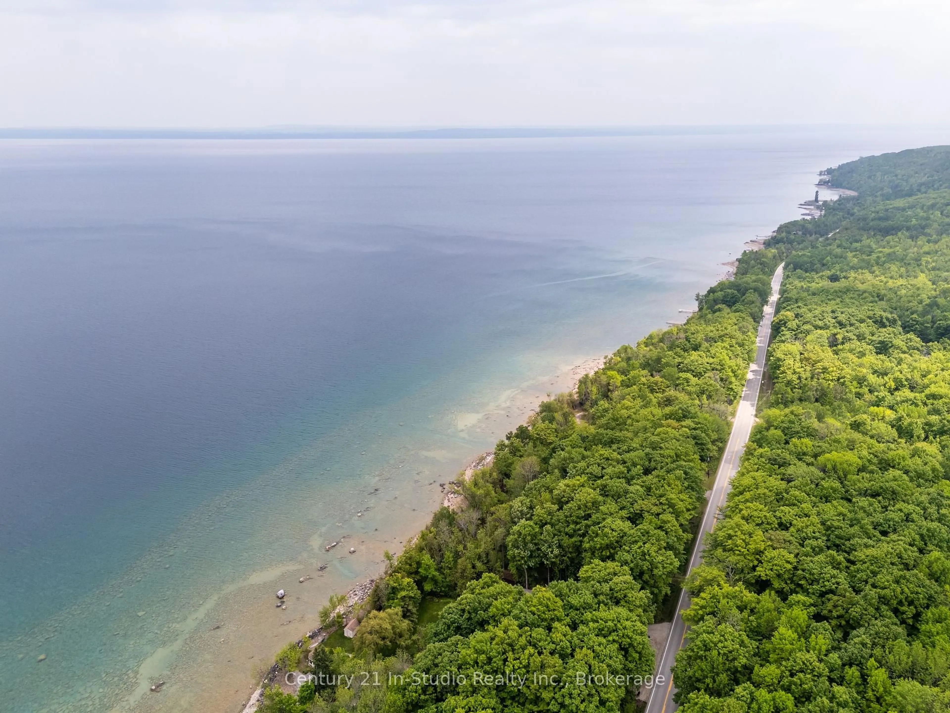 A pic from outside/outdoor area/front of a property/back of a property/a pic from drone, water/lake/river/ocean view for 504877 GREY 1 Rd, Georgian Bluffs Ontario N0H 1S0