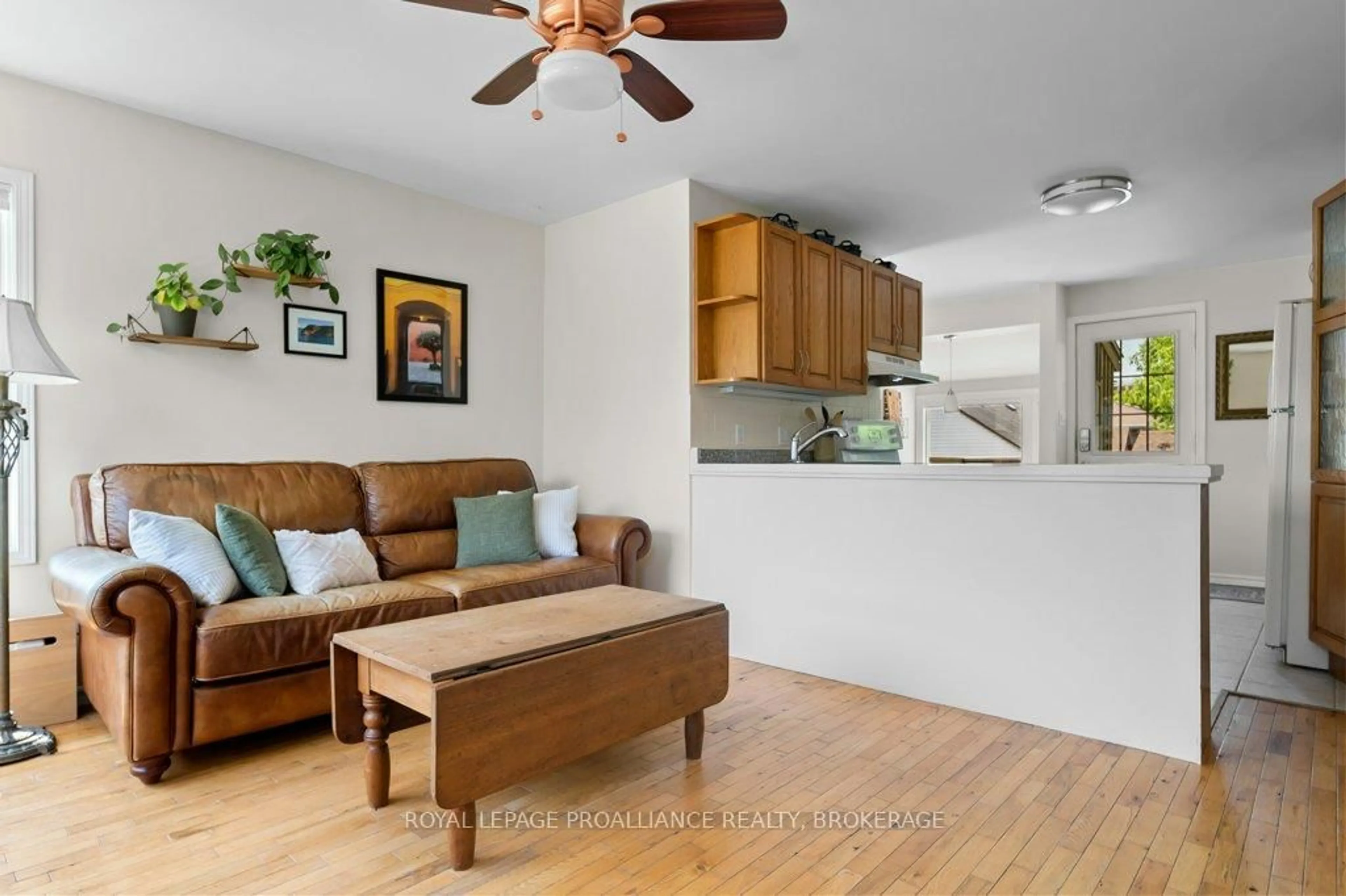 Living room with furniture, wood/laminate floor for 754 Victoria St, Kingston Ontario K7K 4T1