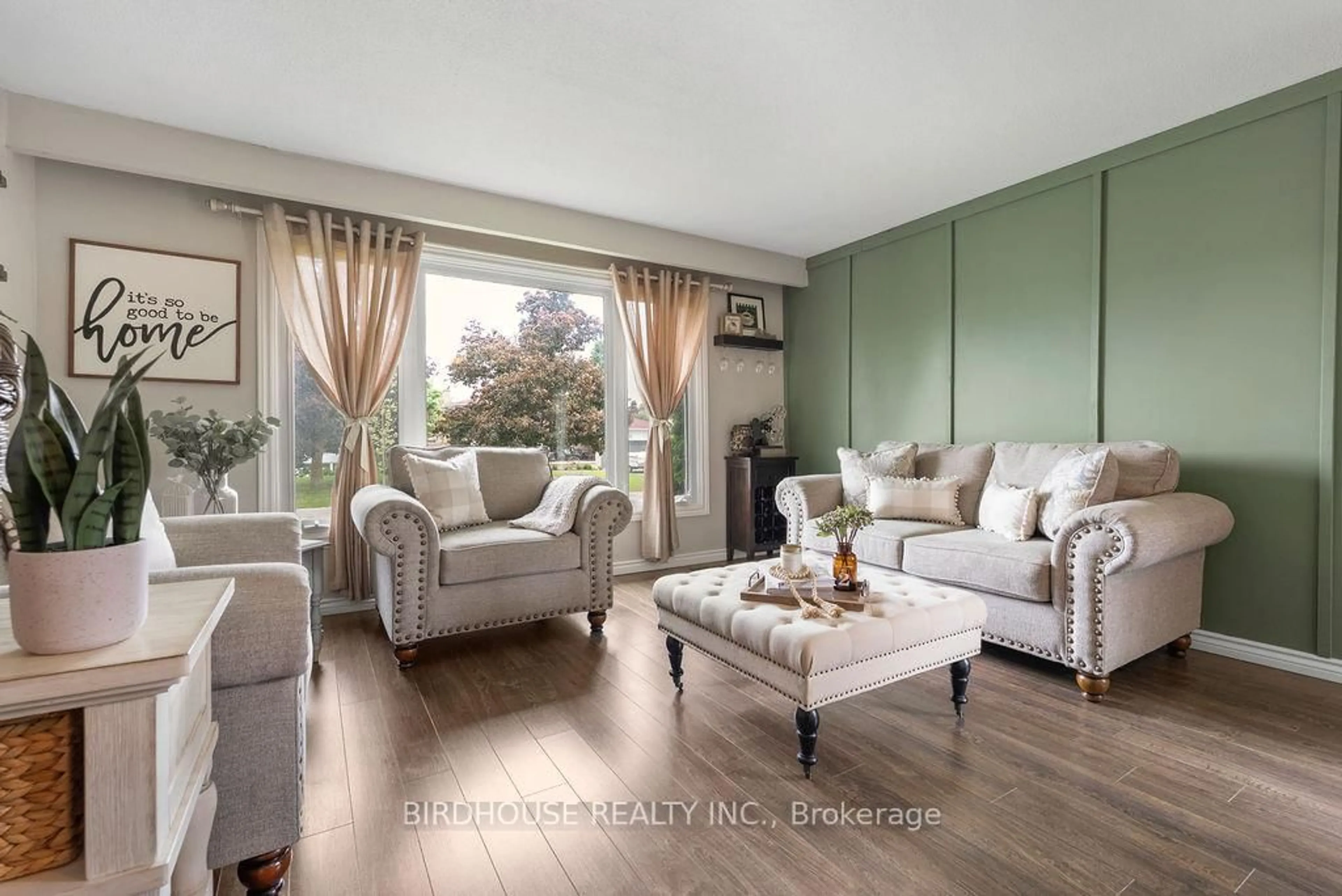 Living room with furniture, wood/laminate floor for 15 Redwing St, Kawartha Lakes Ontario K9V 4T4