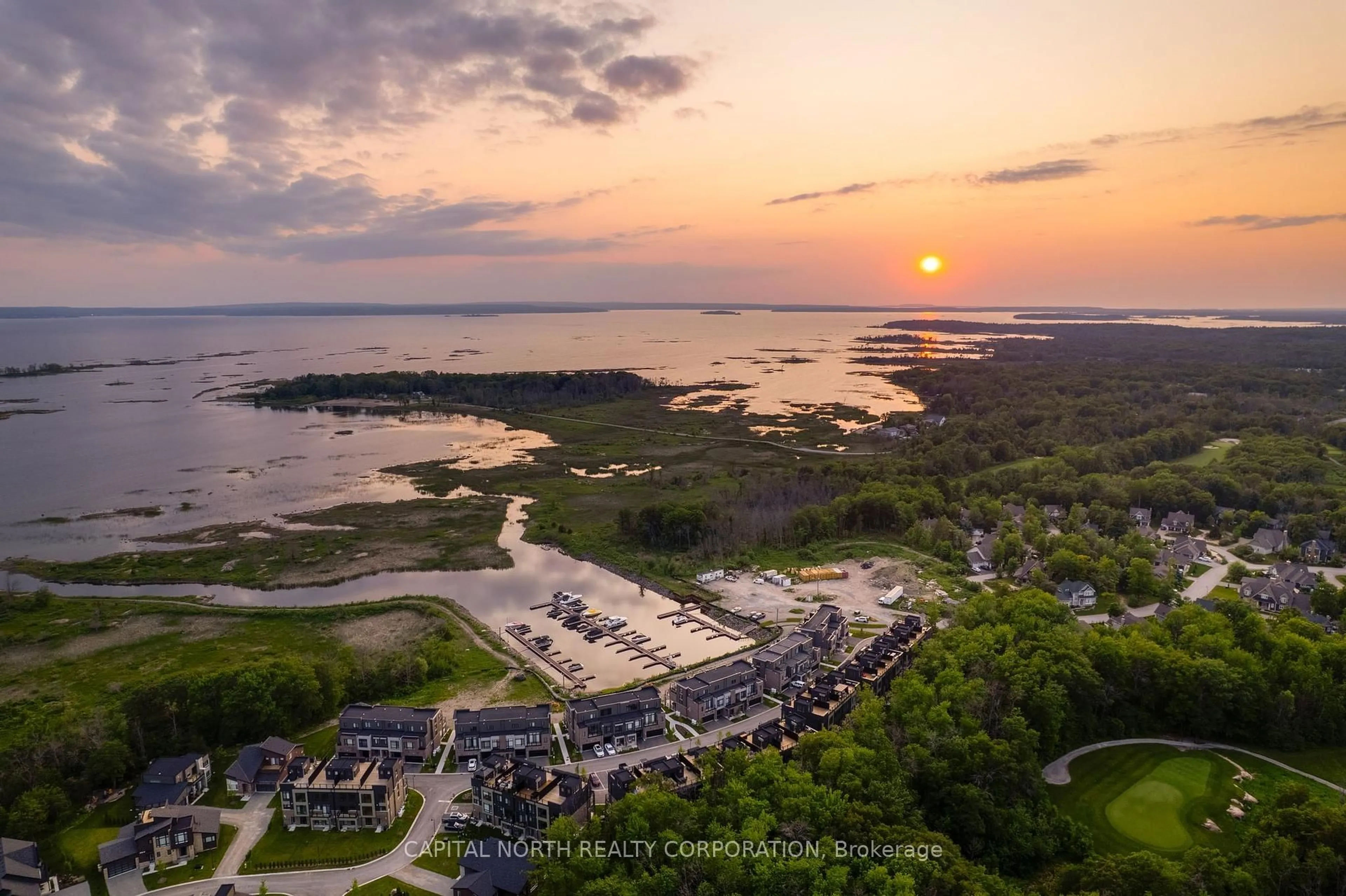 A pic from outside/outdoor area/front of a property/back of a property/a pic from drone, water/lake/river/ocean view for 74 Marina Village Dr, Georgian Bay Ontario L0K 1S0