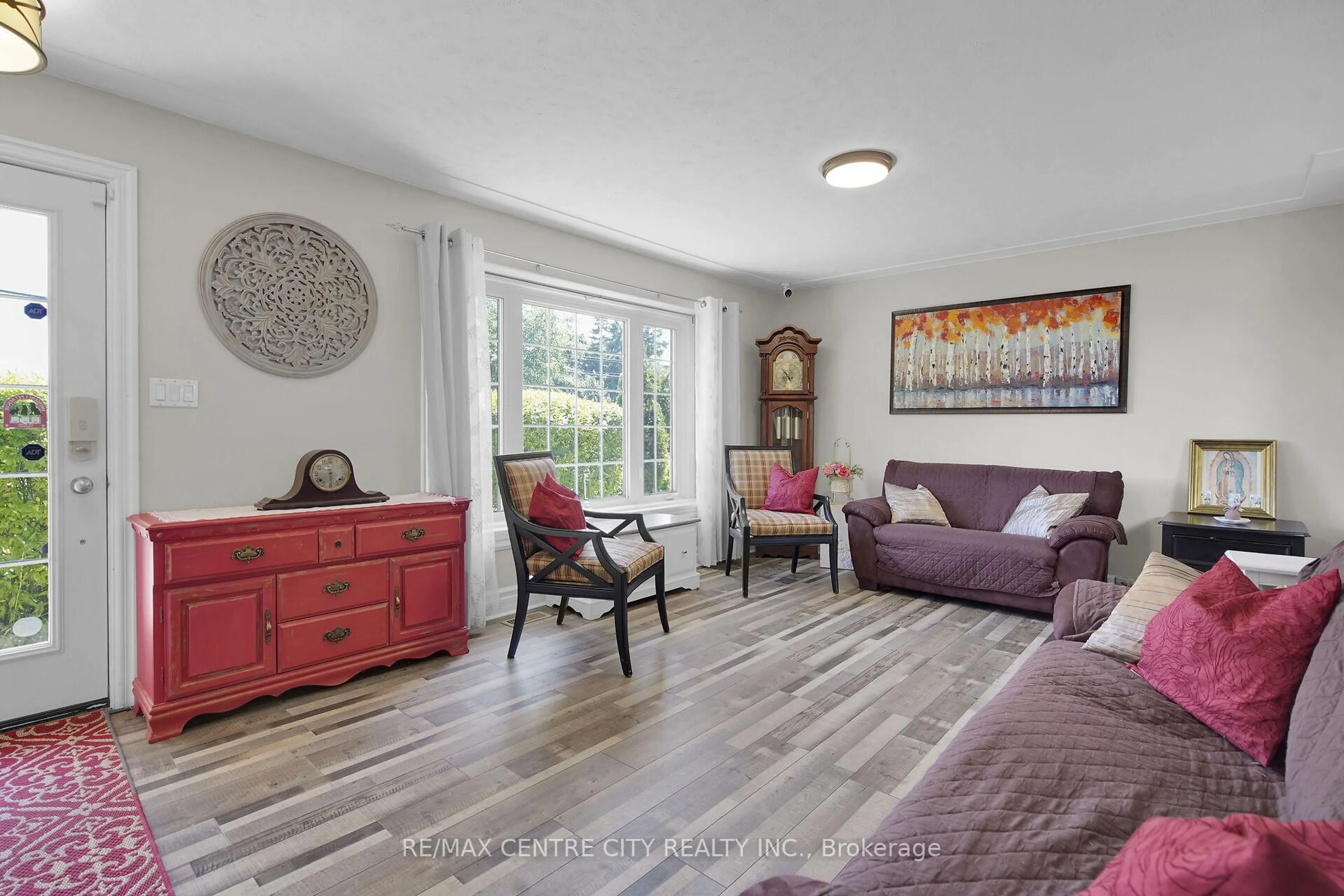 Living room with furniture, wood/laminate floor for 2103 Fanshawe Park Rd, Middlesex Centre Ontario N6H 0H6
