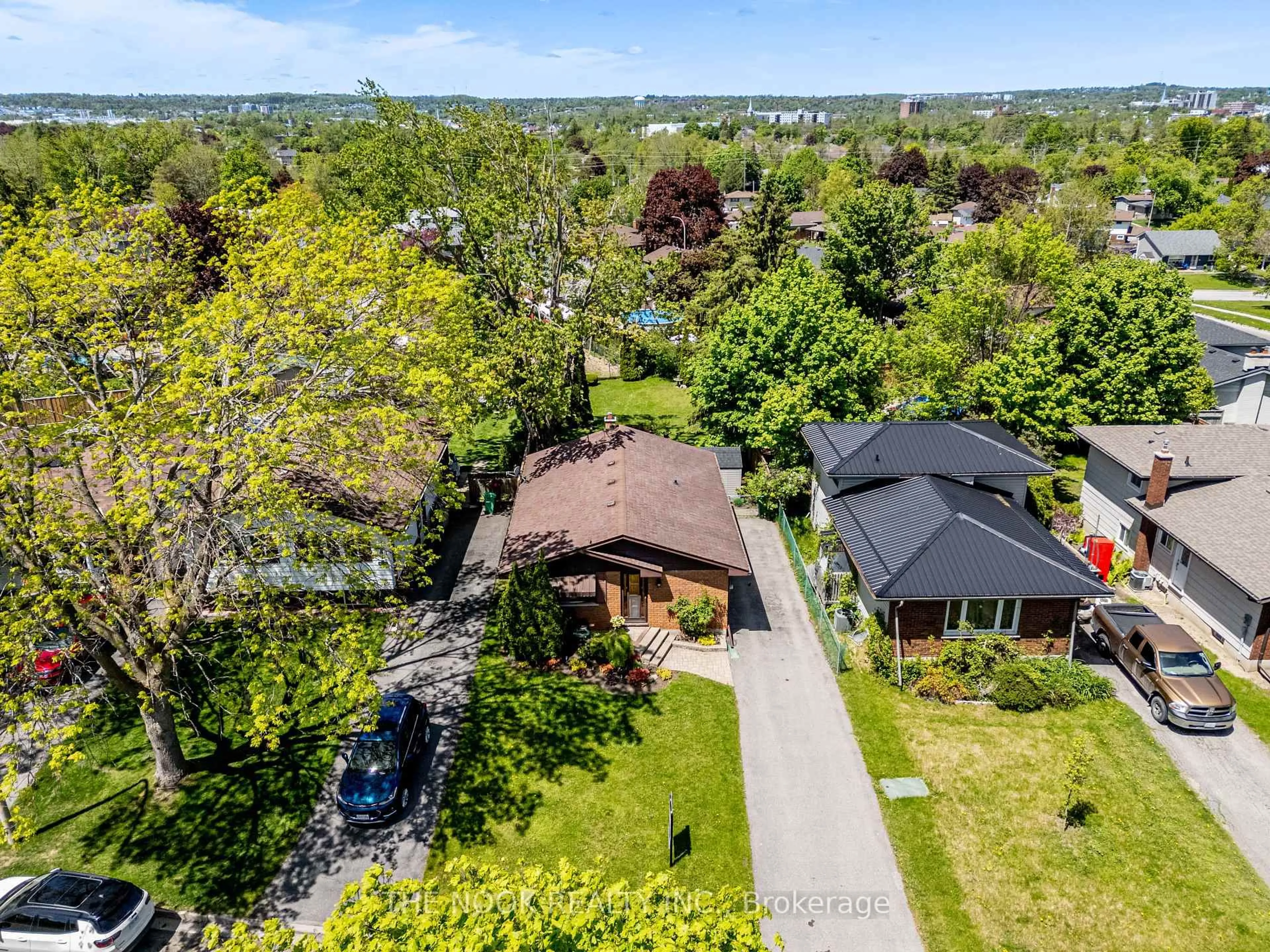 A pic from outside/outdoor area/front of a property/back of a property/a pic from drone, street for 21 Rideau Cres, Peterborough South Ontario K9J 1G7