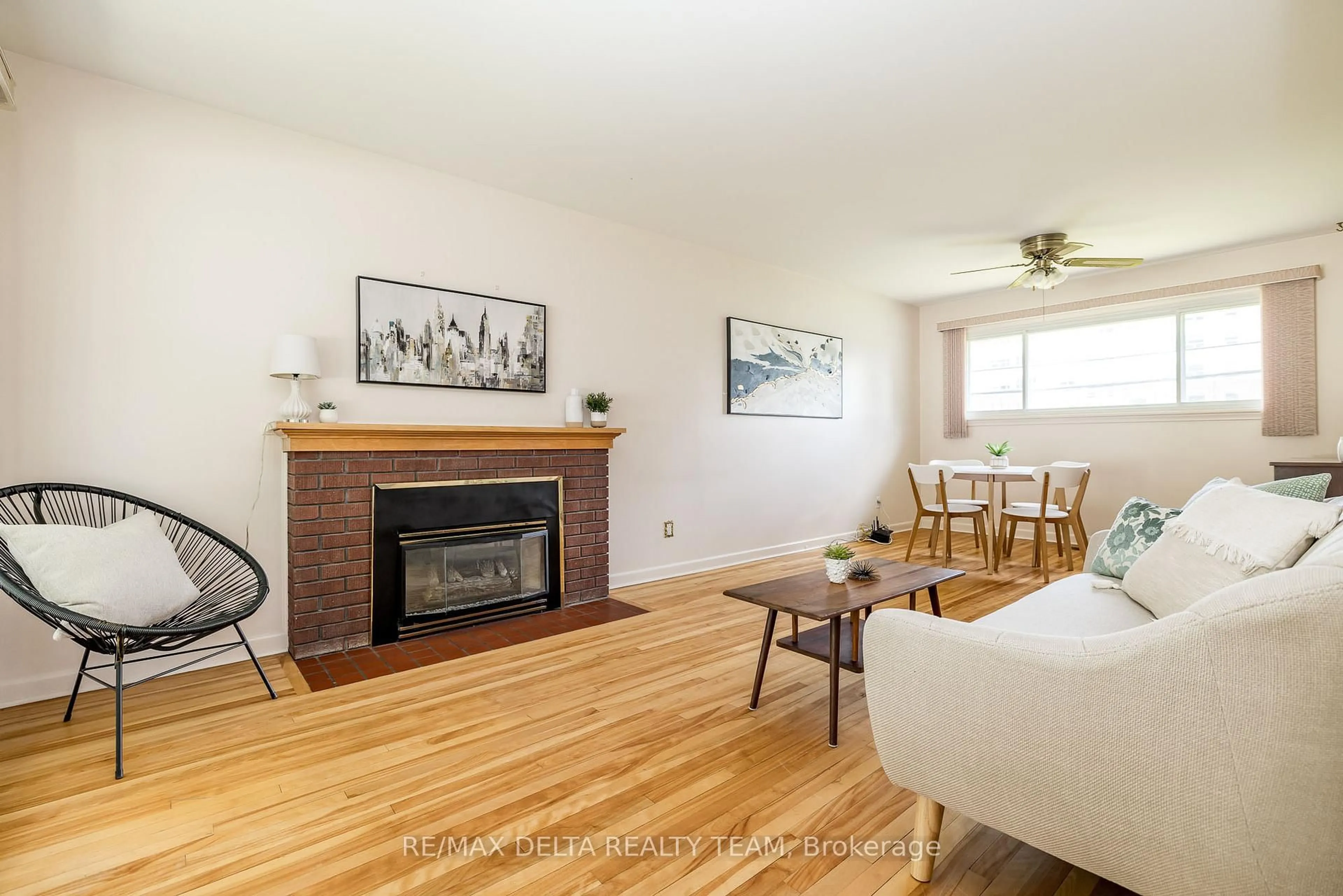 Living room with furniture, wood/laminate floor for 644 Browning Ave, Ottawa Ontario K1G 0T9