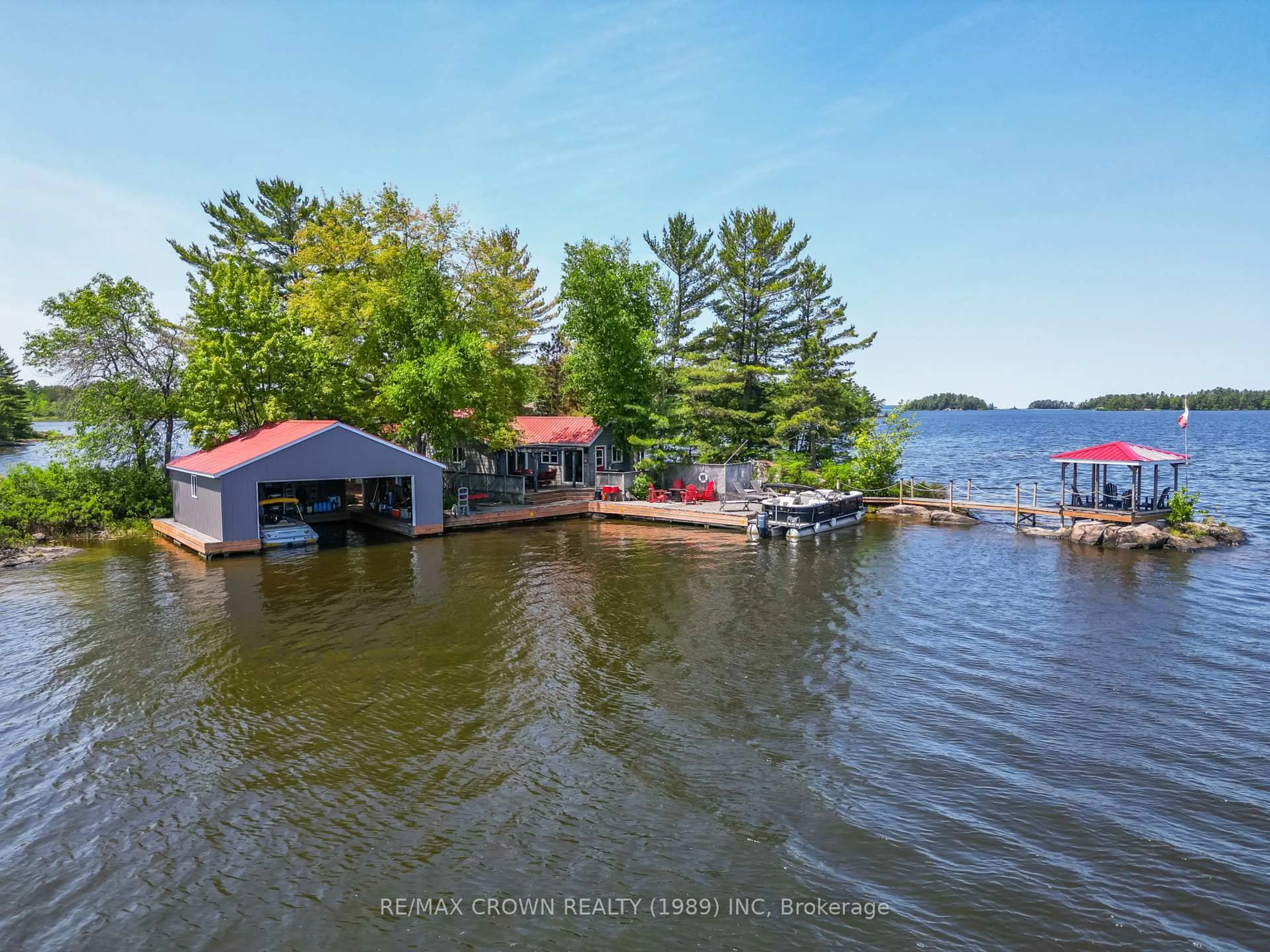 A pic from outside/outdoor area/front of a property/back of a property/a pic from drone, water/lake/river/ocean view for 125 Bracken Island 125, Callander Ontario P0H 1H0