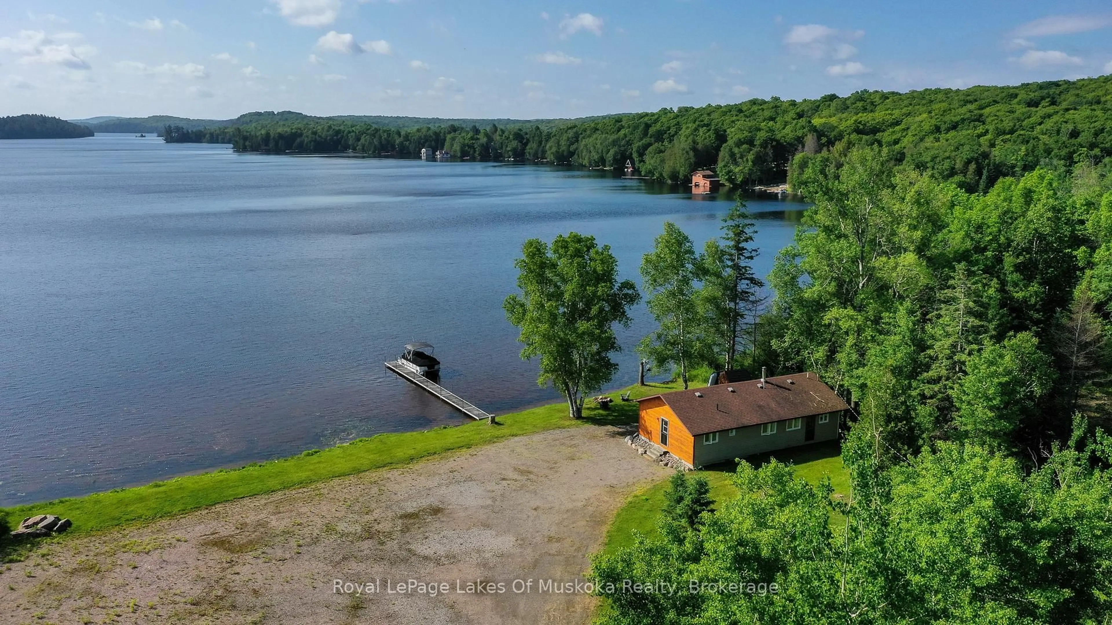 A pic from outside/outdoor area/front of a property/back of a property/a pic from drone, water/lake/river/ocean view for 3105 520 Highway, Magnetawan Ontario P0A 1P0