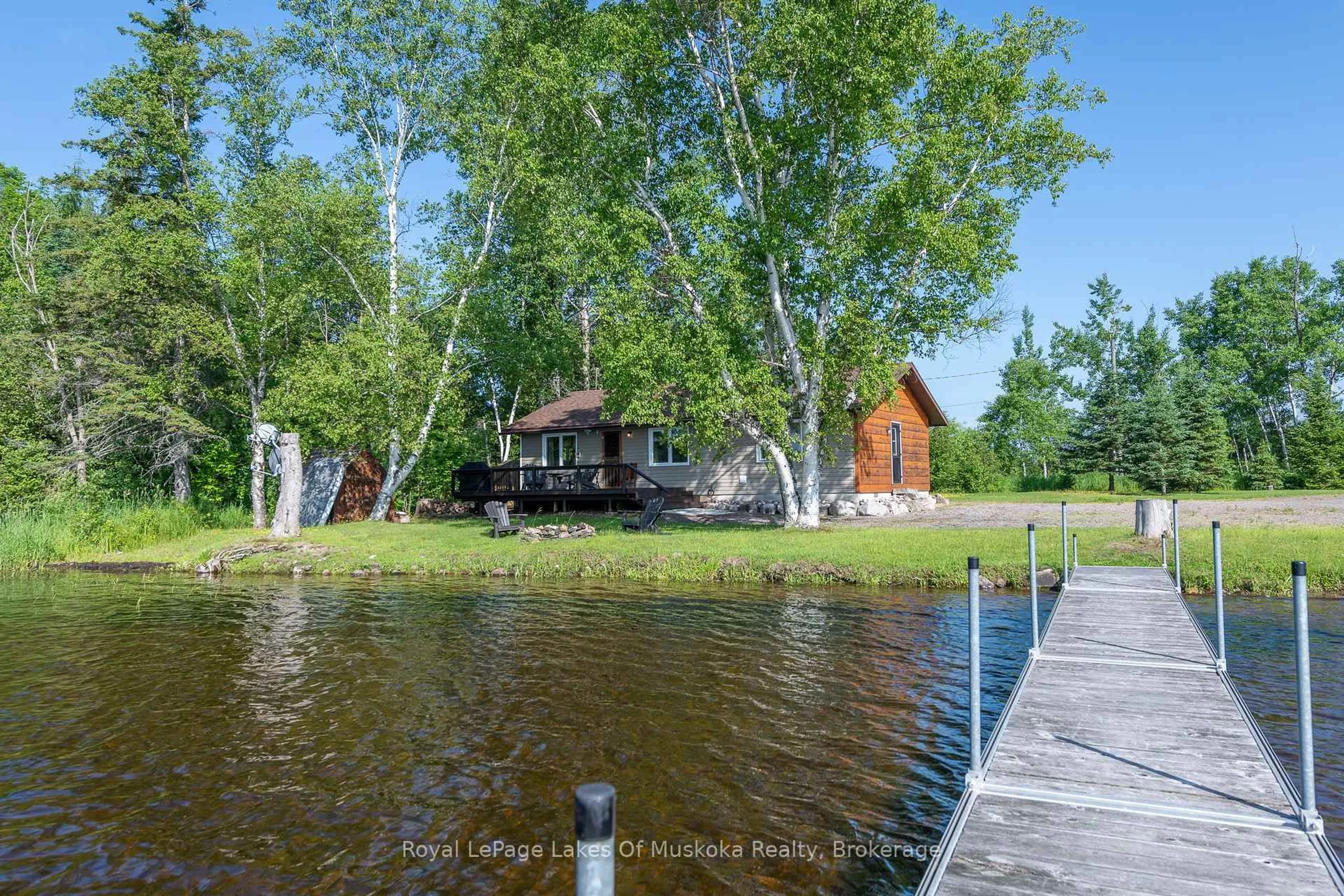 A pic from outside/outdoor area/front of a property/back of a property/a pic from drone, water/lake/river/ocean view for 3105 520 Highway, Magnetawan Ontario P0A 1P0