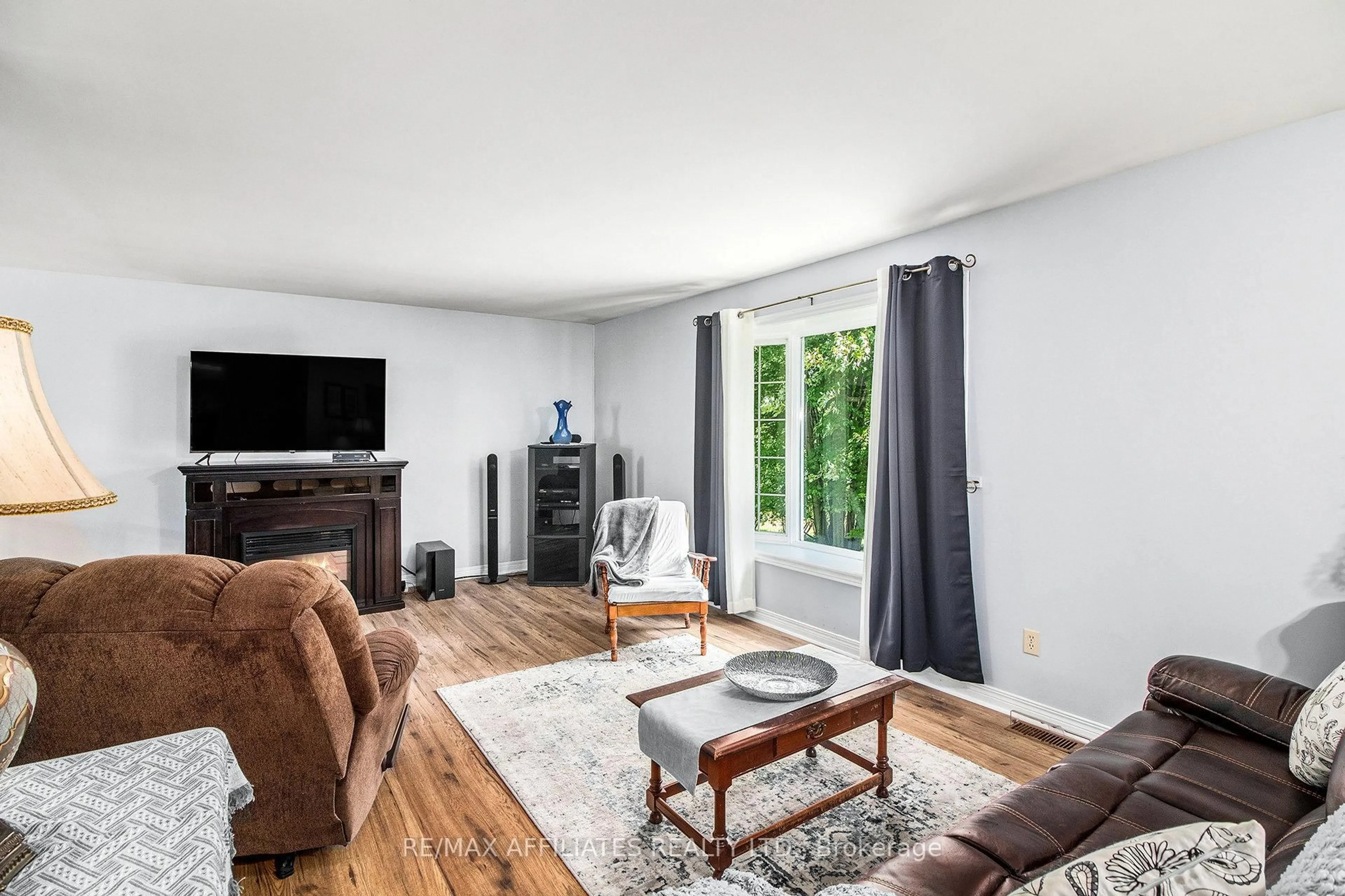 Living room with furniture, wood/laminate floor for 9674 Hall Rd, Augusta Ontario K0G 1R0
