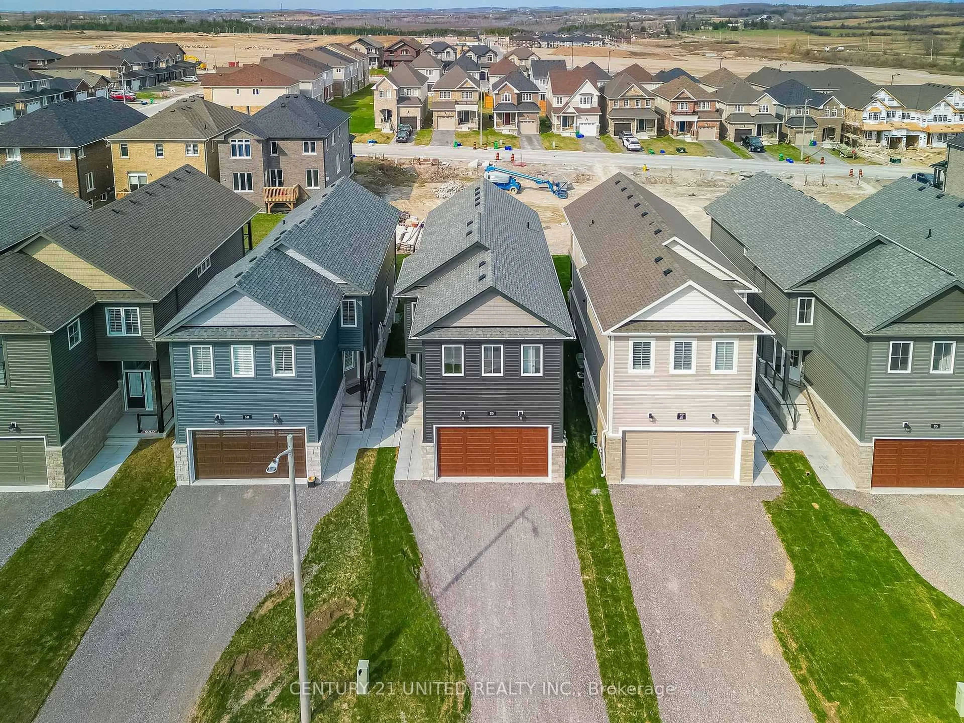 A pic from outside/outdoor area/front of a property/back of a property/a pic from drone, street for 319 Mullighan Gdns, Peterborough North Ontario K9K 0H2