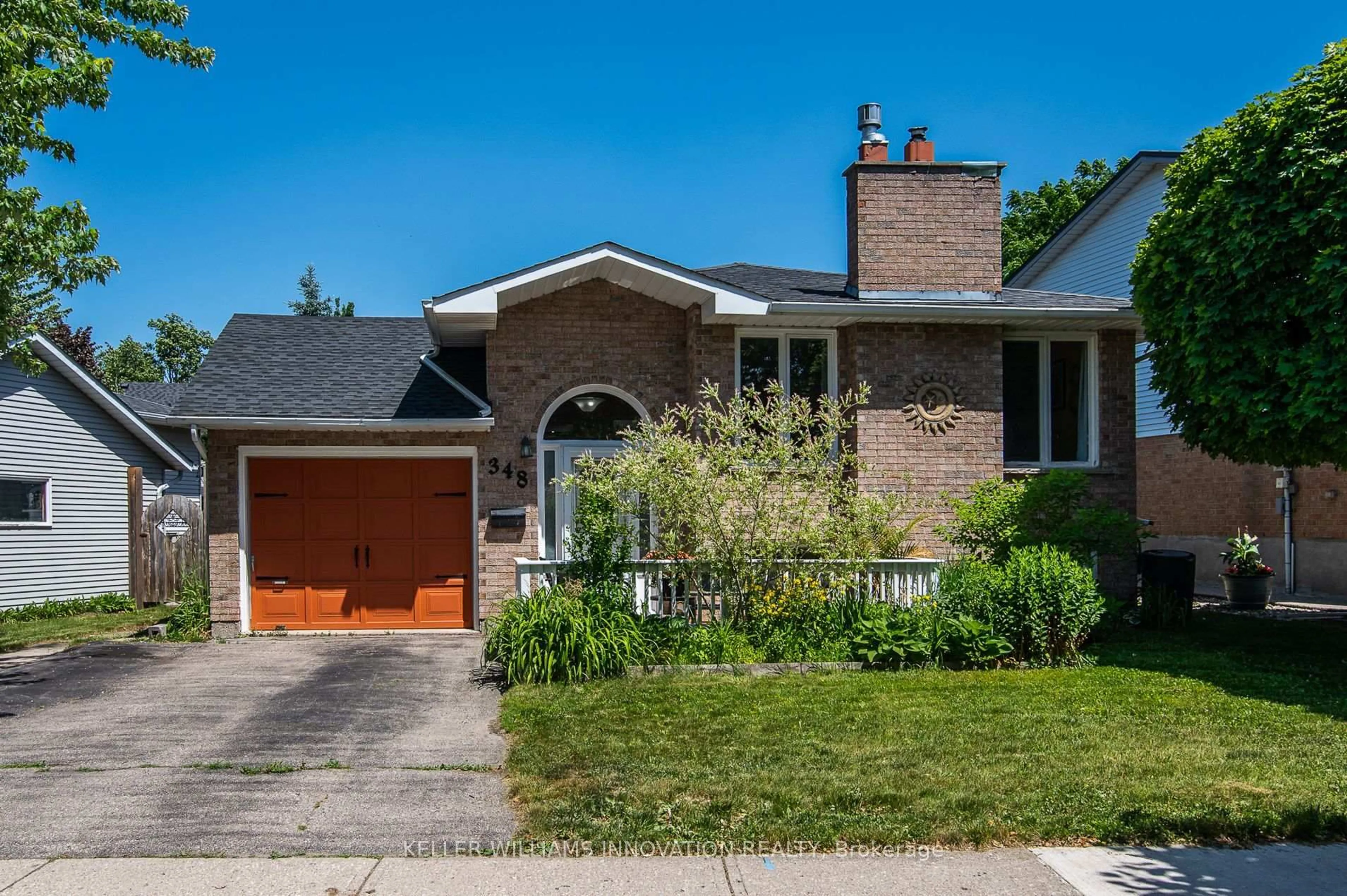 Home with brick exterior material, street for 348 Auburn Dr, Waterloo Ontario N2K 3T1