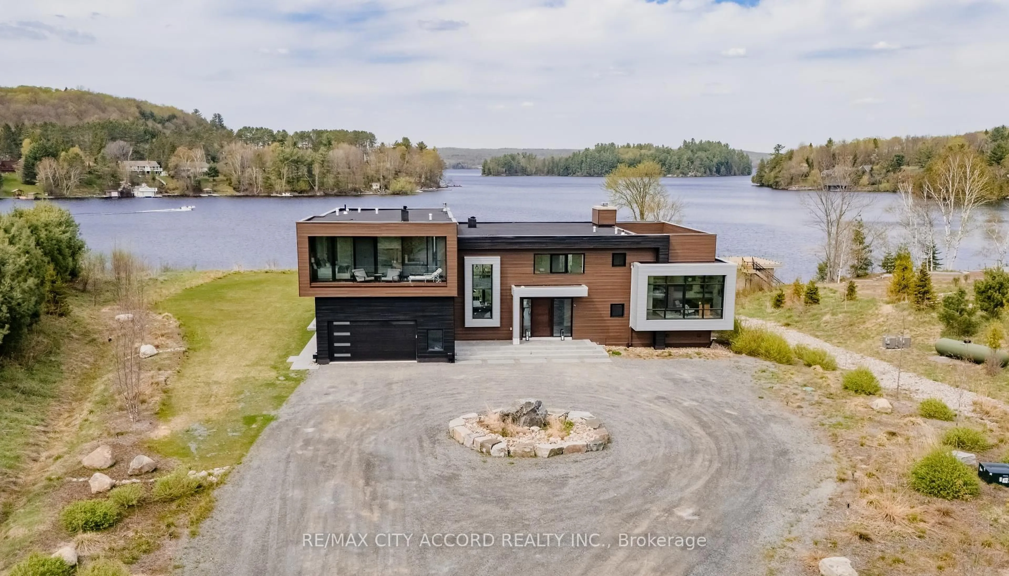 A pic from outside/outdoor area/front of a property/back of a property/a pic from drone, water/lake/river/ocean view for 23 EUROPE Lane, Huntsville Ontario P1H 2J3