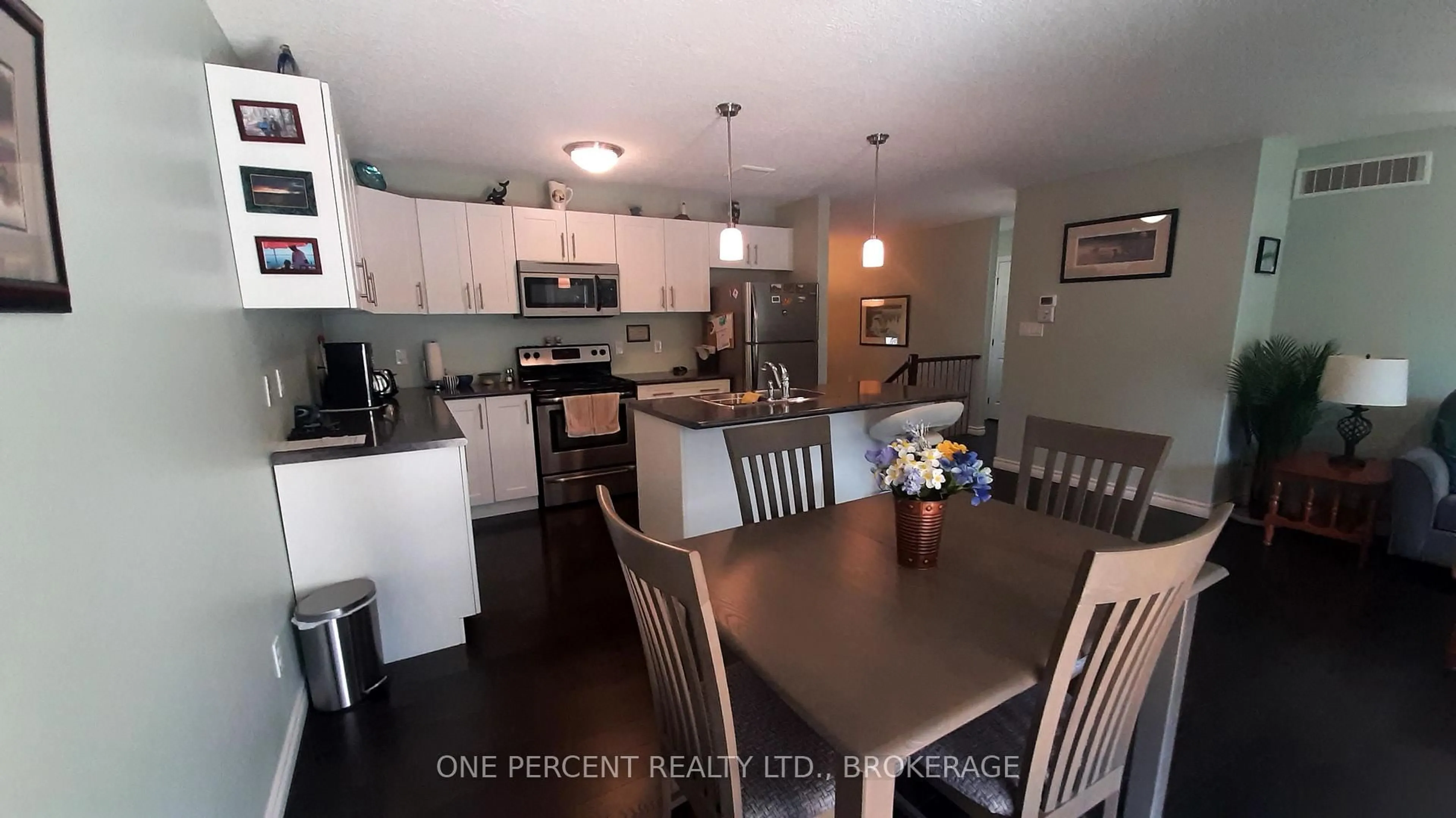 Open concept kitchen, wood/laminate floor for 163 Greenhill Lane, Belleville Ontario K8N 0C7