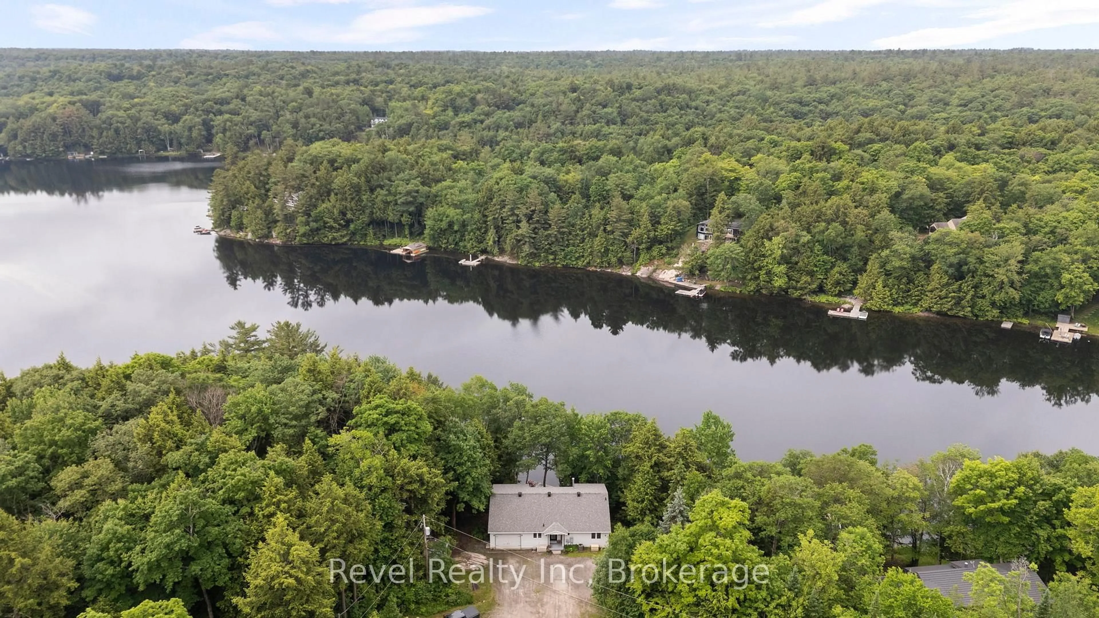 A pic from outside/outdoor area/front of a property/back of a property/a pic from drone, water/lake/river/ocean view for 30 Sparrow Rd, Seguin Ontario P0C 1J0