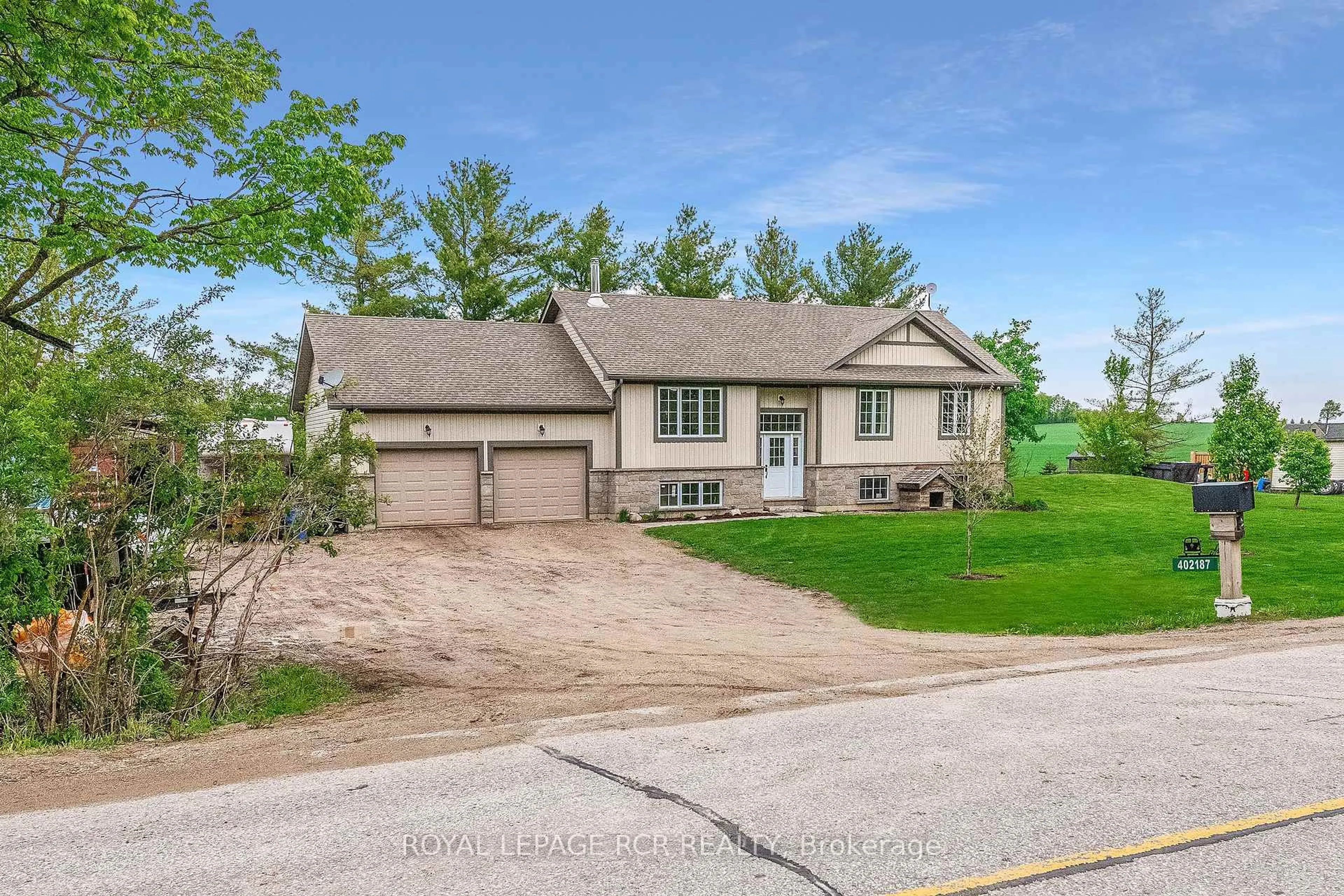 A pic from outside/outdoor area/front of a property/back of a property/a pic from drone, street for 402187 County Road 15, East Luther Grand Valley Ontario L9W 3B5