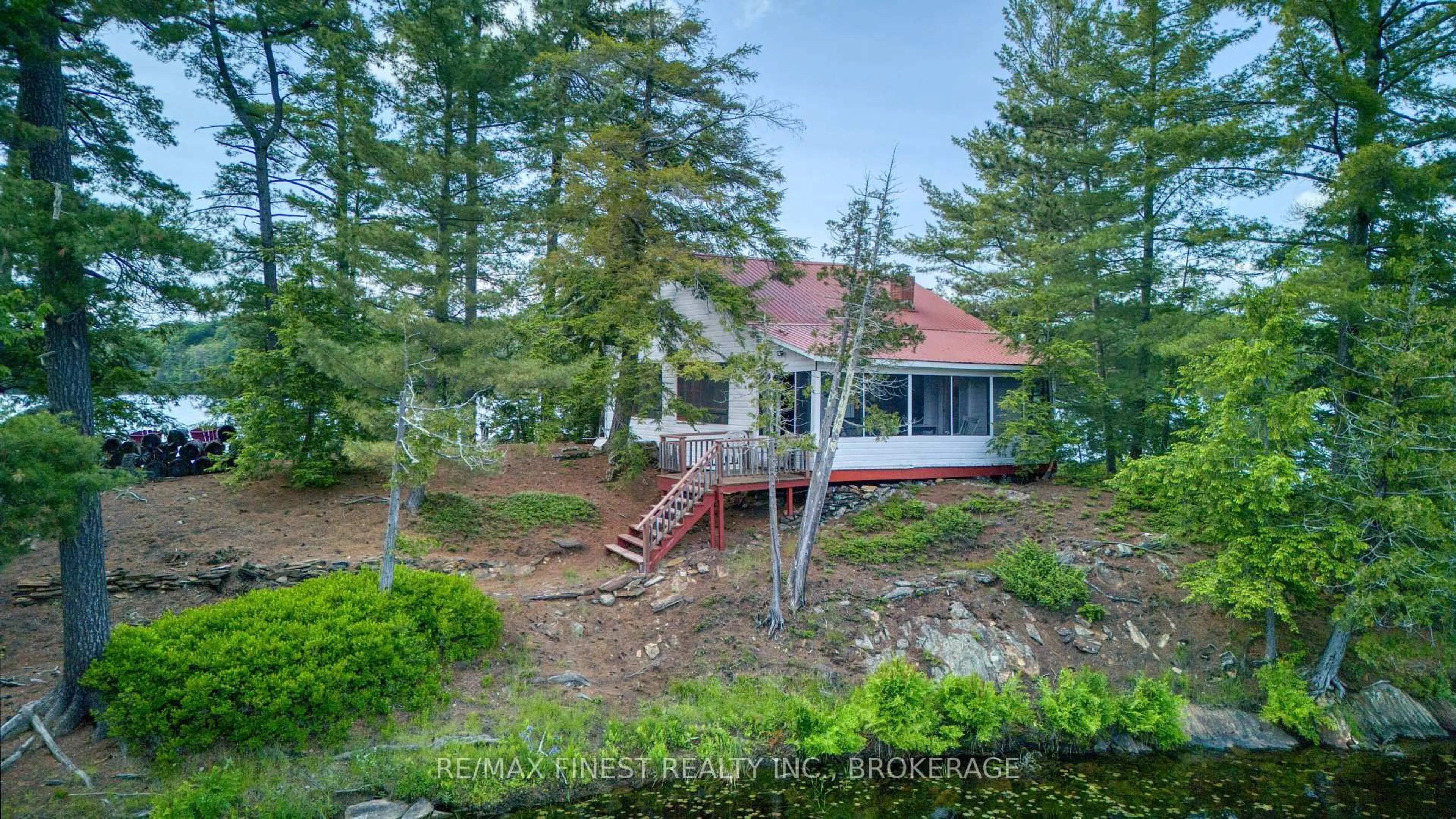 A pic from outside/outdoor area/front of a property/back of a property/a pic from drone, water/lake/river/ocean view for 259 Island 1, Sharbot Lake Ontario K0H 2P0