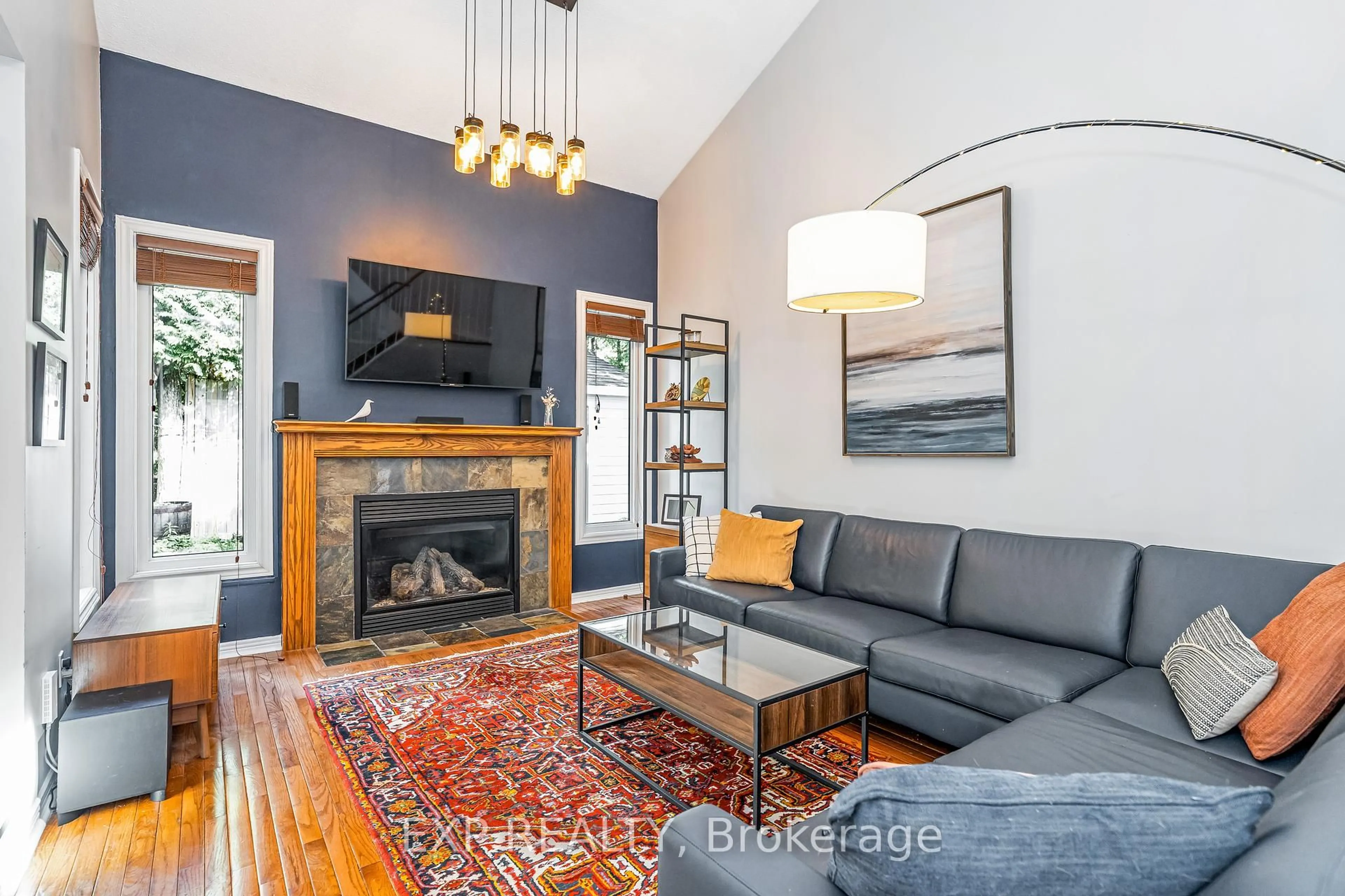 Living room with furniture, wood/laminate floor for 18 Hawley Cres, Ottawa Ontario K2M 1T3