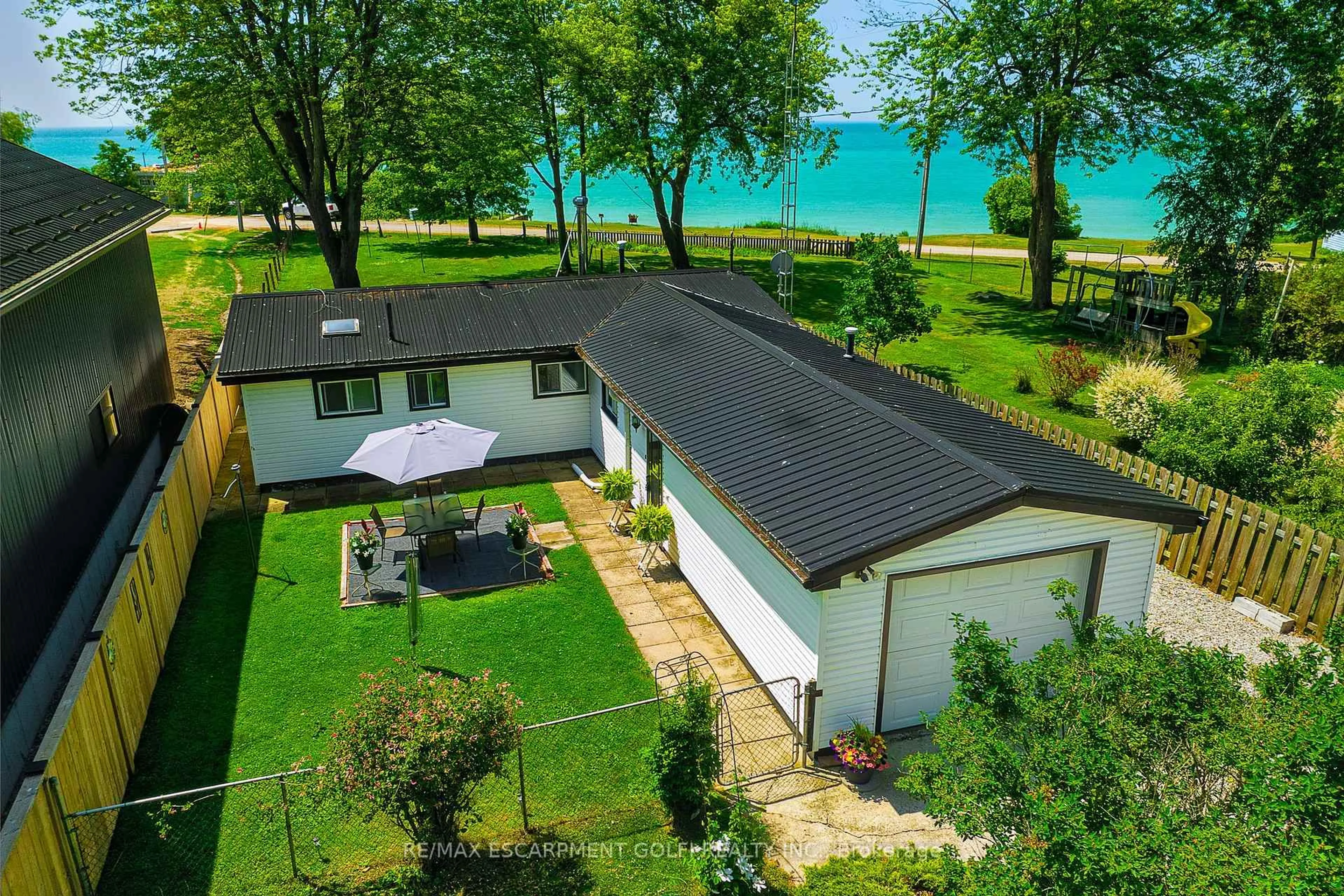 A pic from outside/outdoor area/front of a property/back of a property/a pic from drone, water/lake/river/ocean view for 3058 Lakeshore Rd, Haldimand Ontario N1A 2W8