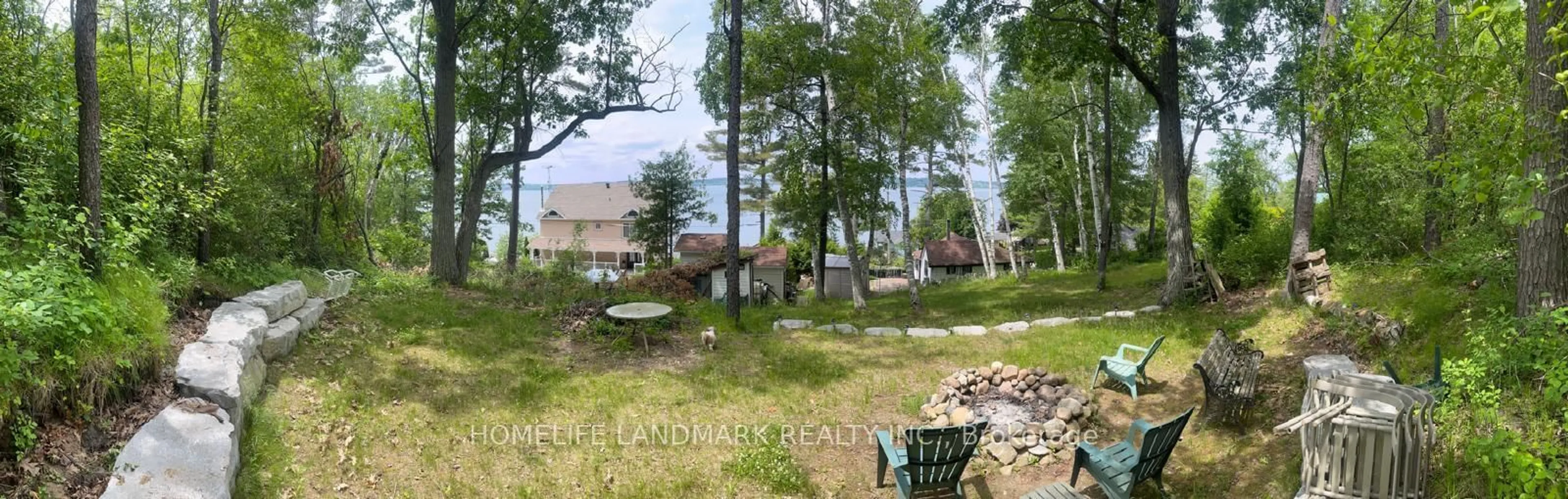 A pic from outside/outdoor area/front of a property/back of a property/a pic from drone, forest/trees view for 8018 Taits Beach Rd #125, Hamilton Township Ontario K0L 1E0
