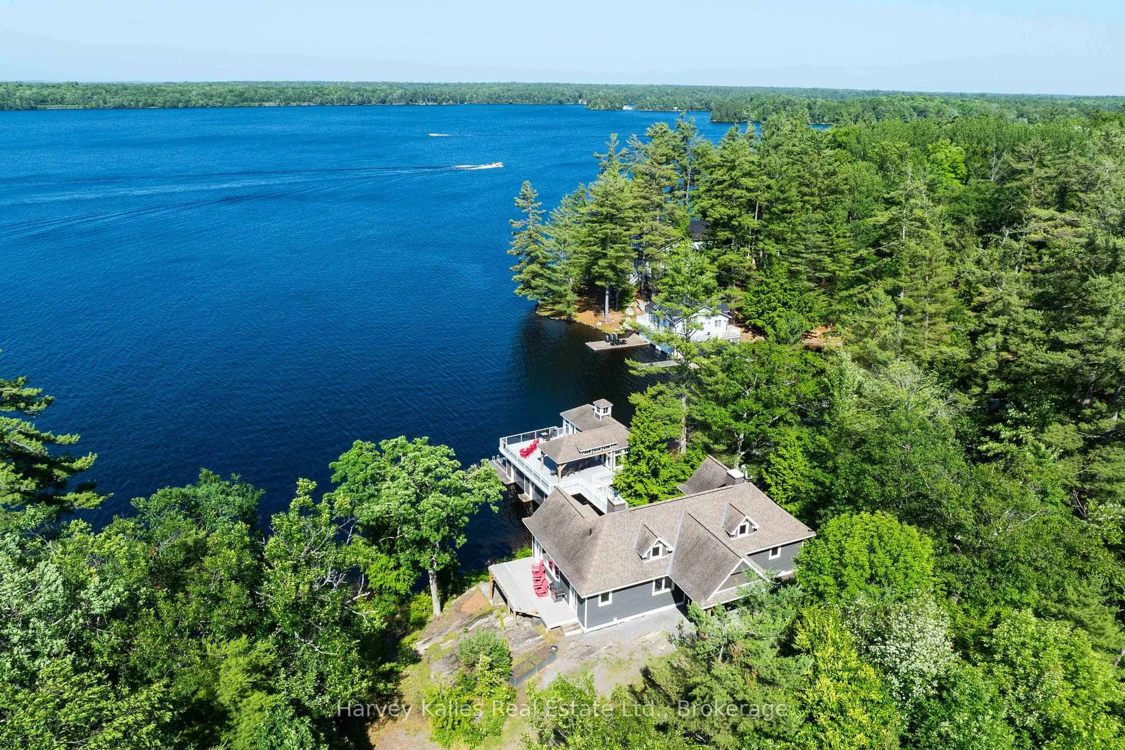 A pic from outside/outdoor area/front of a property/back of a property/a pic from drone, water/lake/river/ocean view for 2948 Muskoka Rd 169, Muskoka Lakes Ontario P0C 1A0