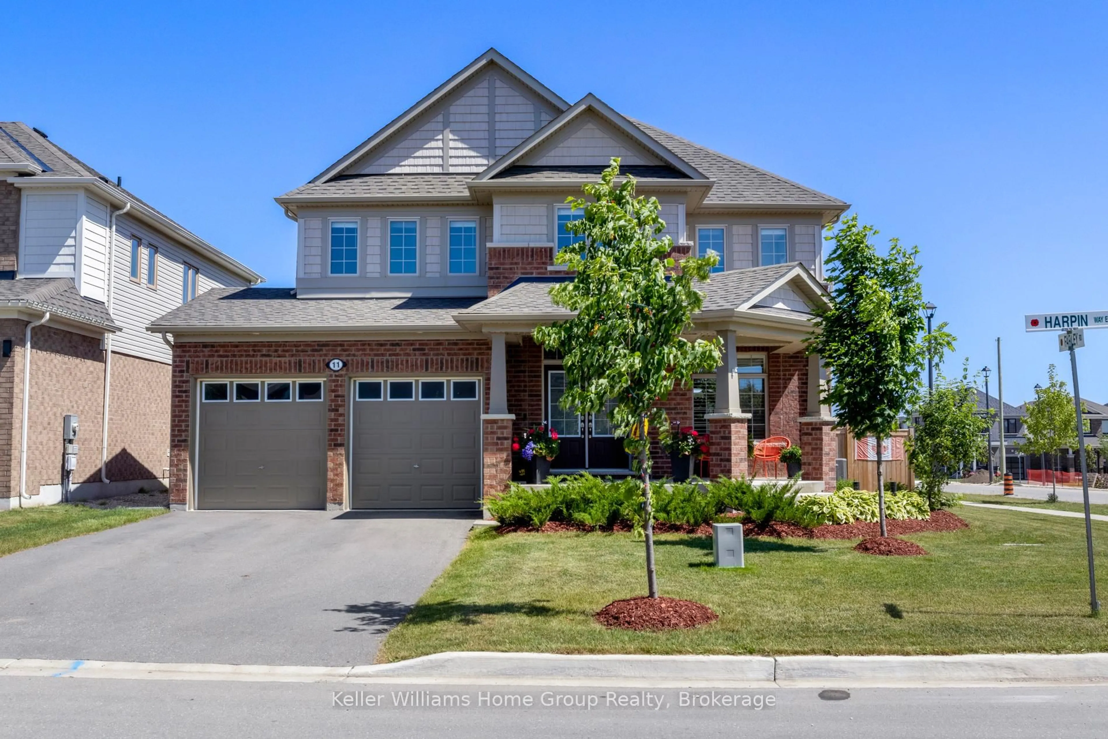 Home with brick exterior material, street for 11 Harpin Way, Centre Wellington Ontario N1M 0H2