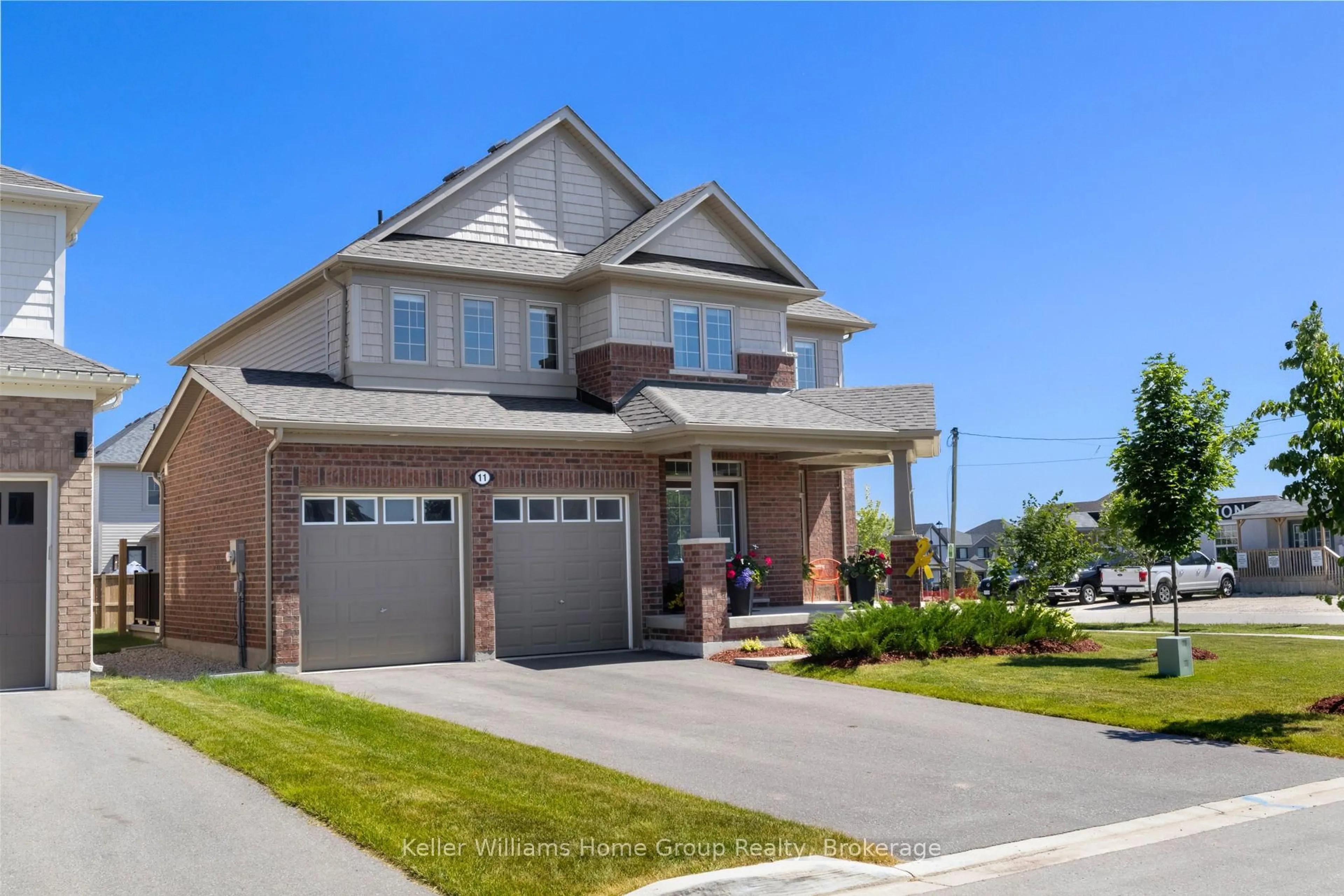 Home with brick exterior material, street for 11 Harpin Way, Centre Wellington Ontario N1M 0H2