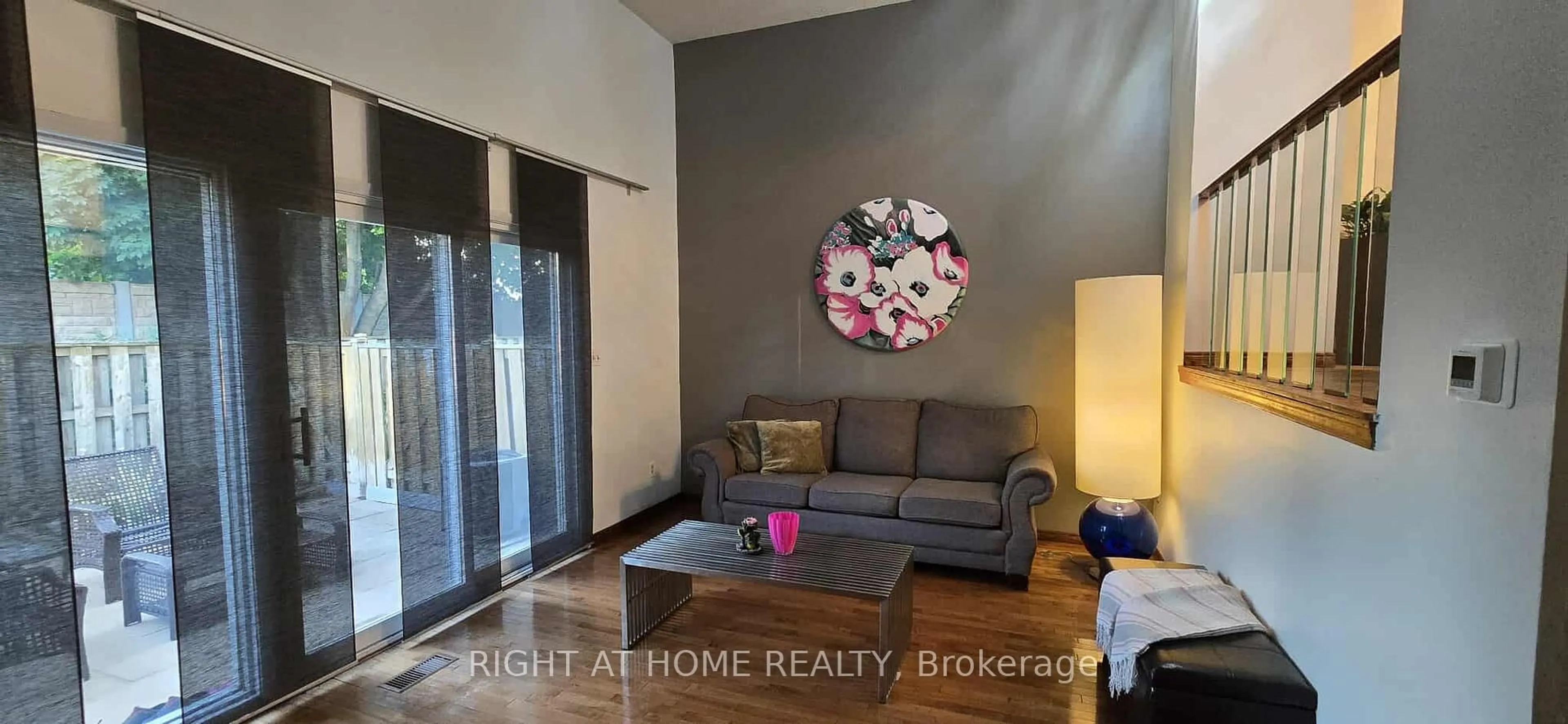Living room with furniture, wood/laminate floor for 11 Harrisford St #68, Hamilton Ontario L8K 6L7