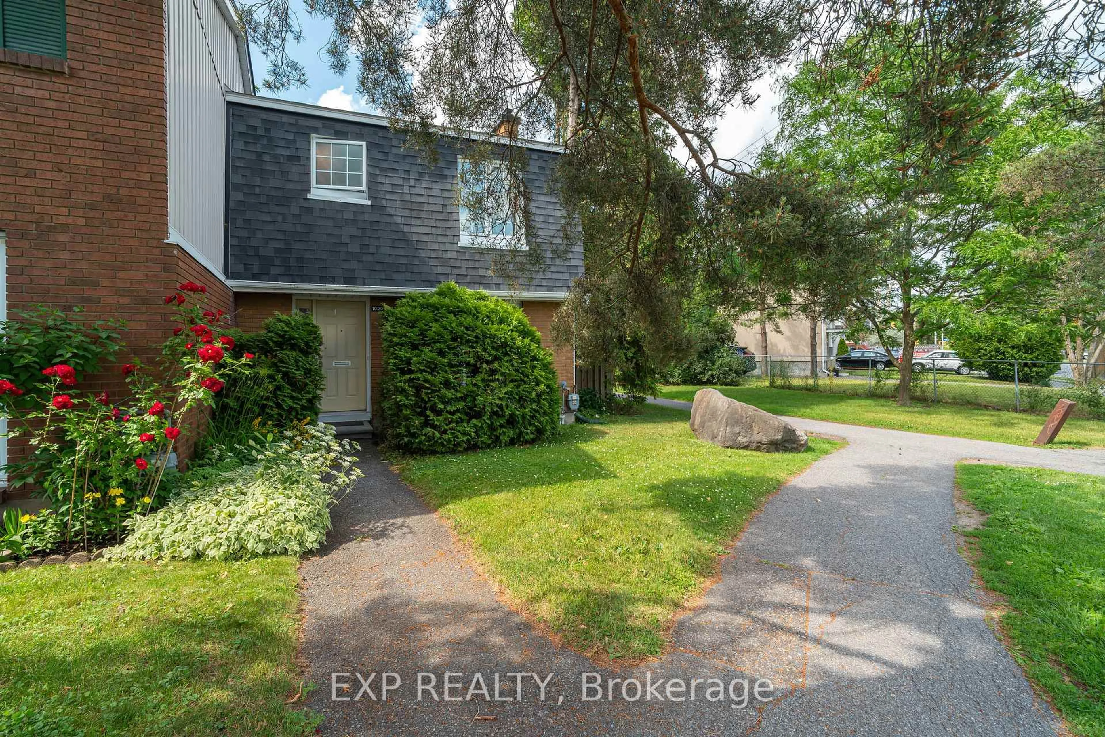 A pic from outside/outdoor area/front of a property/back of a property/a pic from drone, street for 1029 Meadowlands Dr #65, Ottawa Ontario K2C 0K5