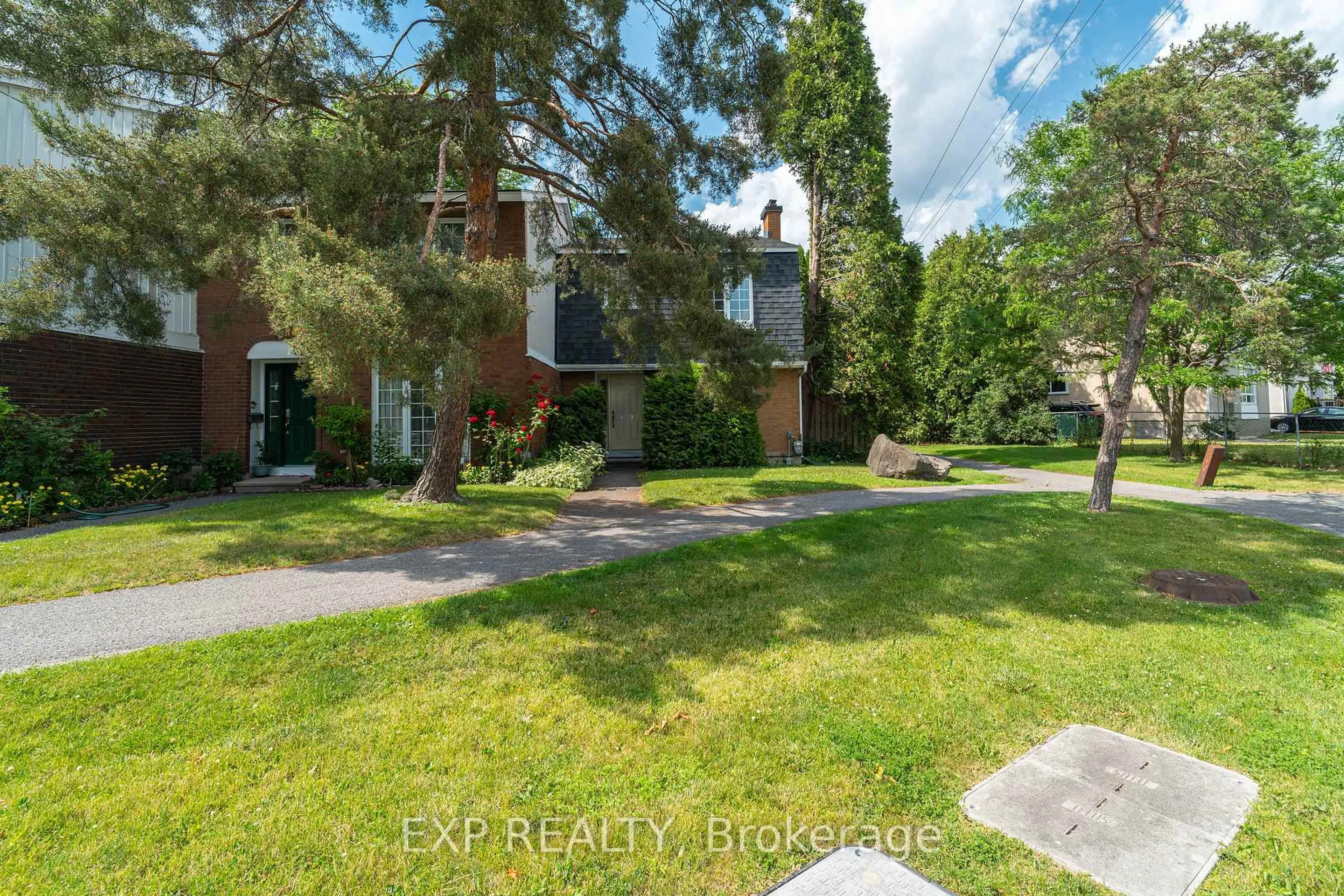 A pic from outside/outdoor area/front of a property/back of a property/a pic from drone, street for 1029 Meadowlands Dr #65, Ottawa Ontario K2C 0K5