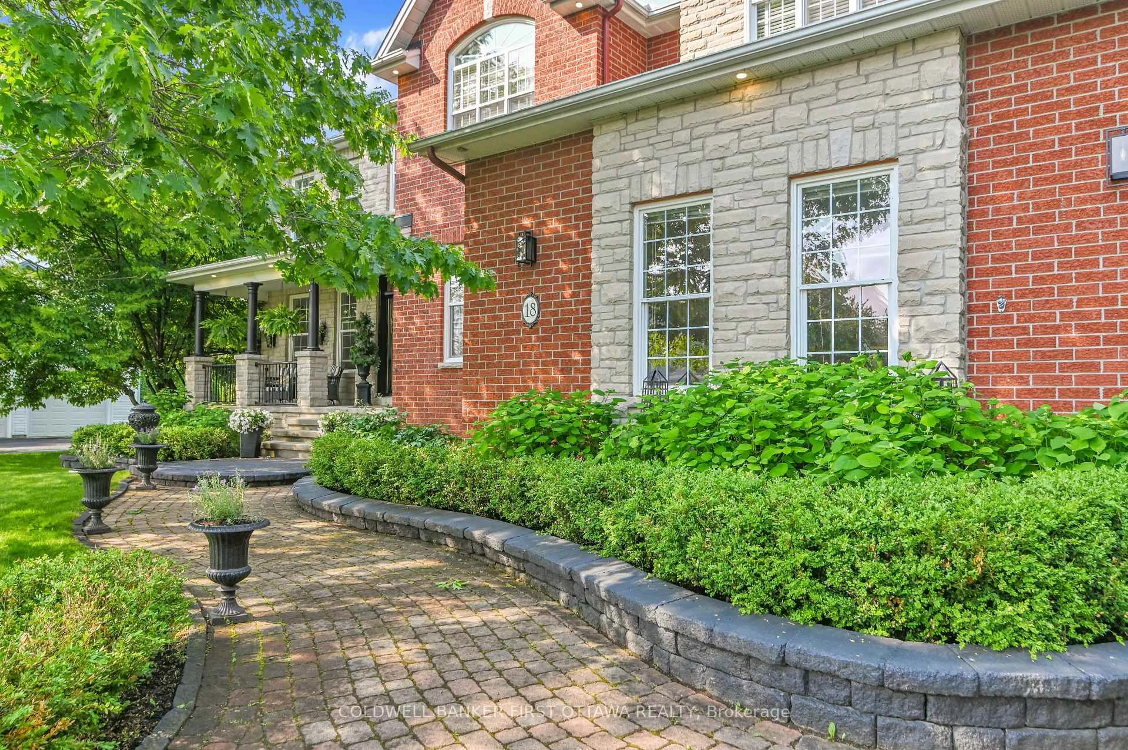 Home with brick exterior material, street for 18 CYPRESS Gdns, Stittsville Ontario K2S 1W6