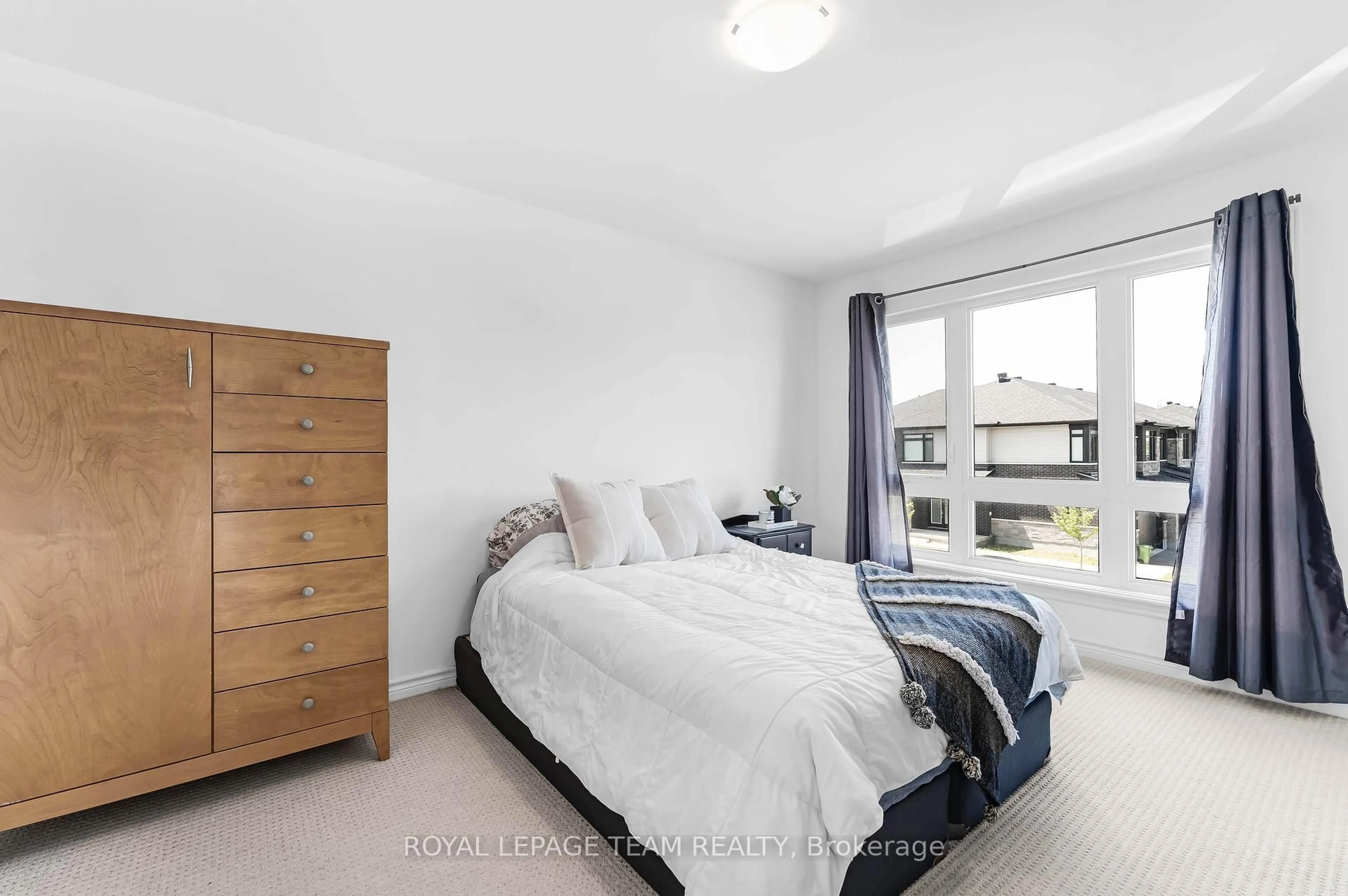 Bedroom with bed, wood/laminate floor for 393 Cornice St St, Ottawa Ontario K1W 0P6