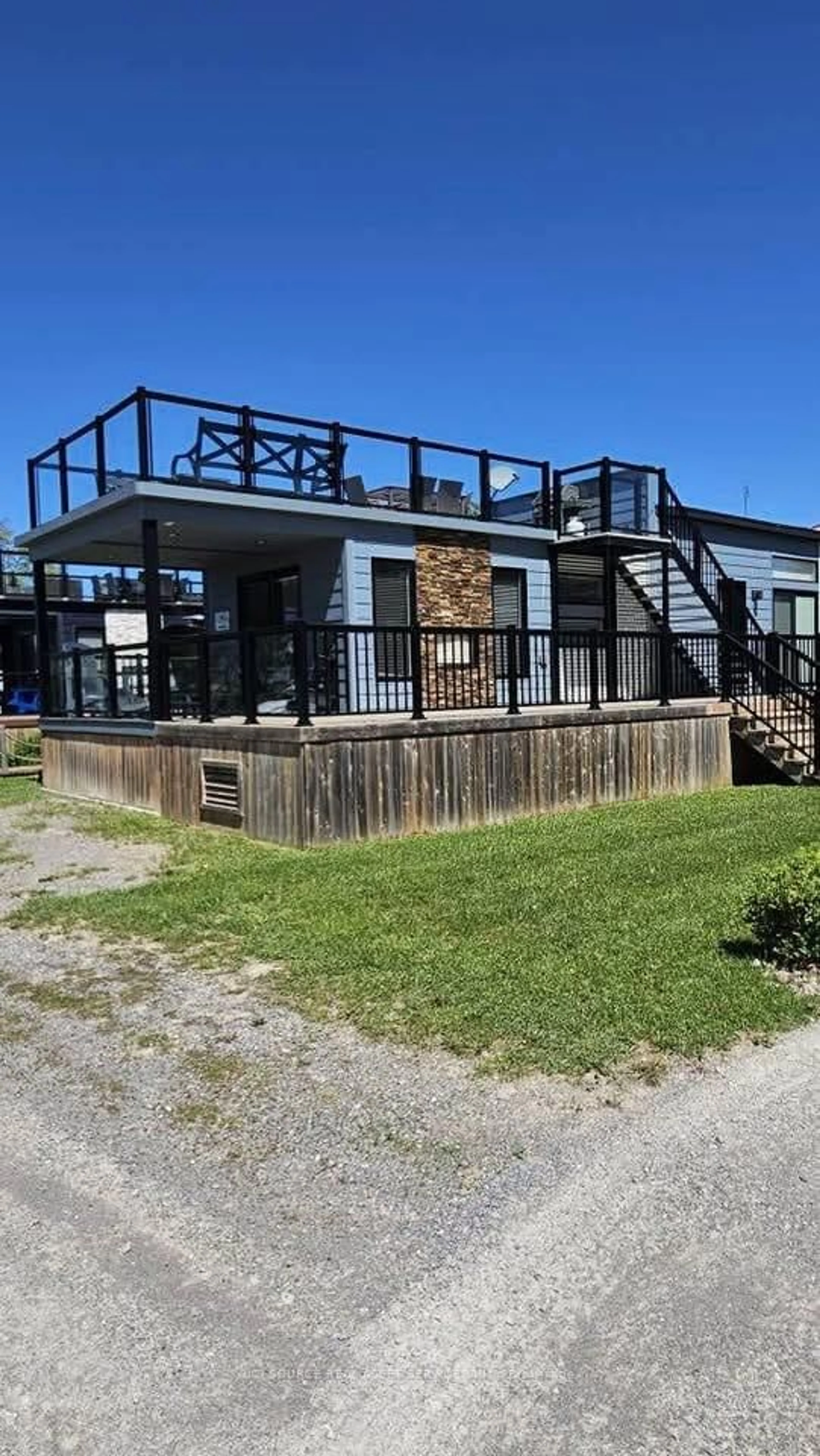 A pic from outside/outdoor area/front of a property/back of a property/a pic from drone, building for 7100 County Rd 18 #SBR06W, Alnwick/Haldimand Ontario K0K 2X0