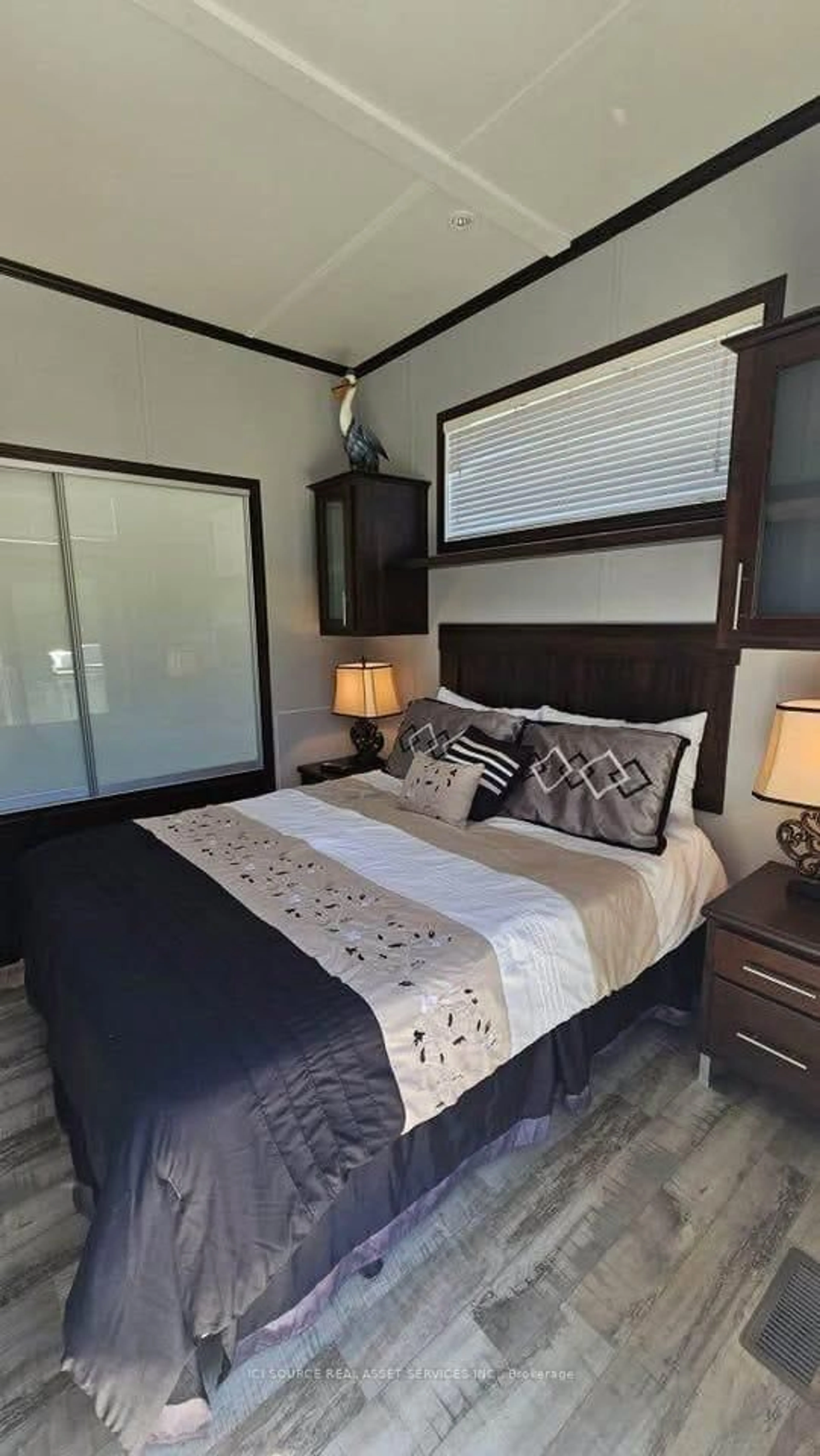 Bedroom with bed, wood/laminate floor for 7100 County Rd 18 #SBR06W, Alnwick/Haldimand Ontario K0K 2X0