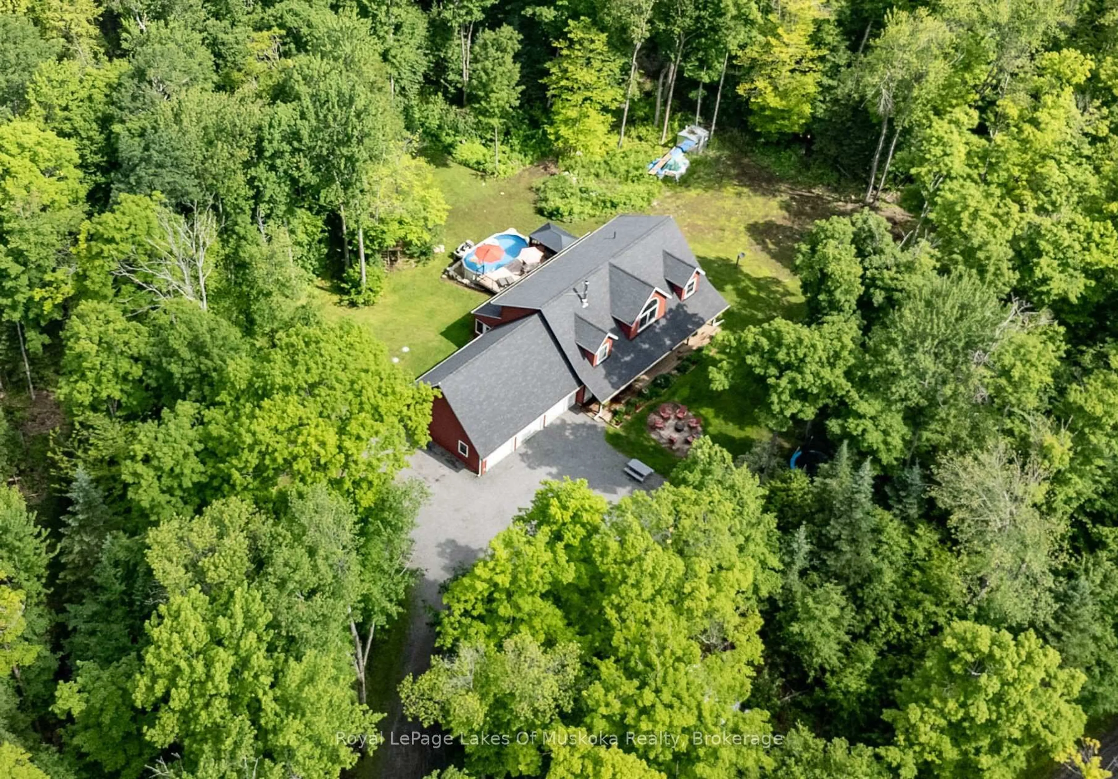 A pic from outside/outdoor area/front of a property/back of a property/a pic from drone, forest/trees view for 1099 Moot Lake Rd, Lake of Bays Ontario P0B 1A0