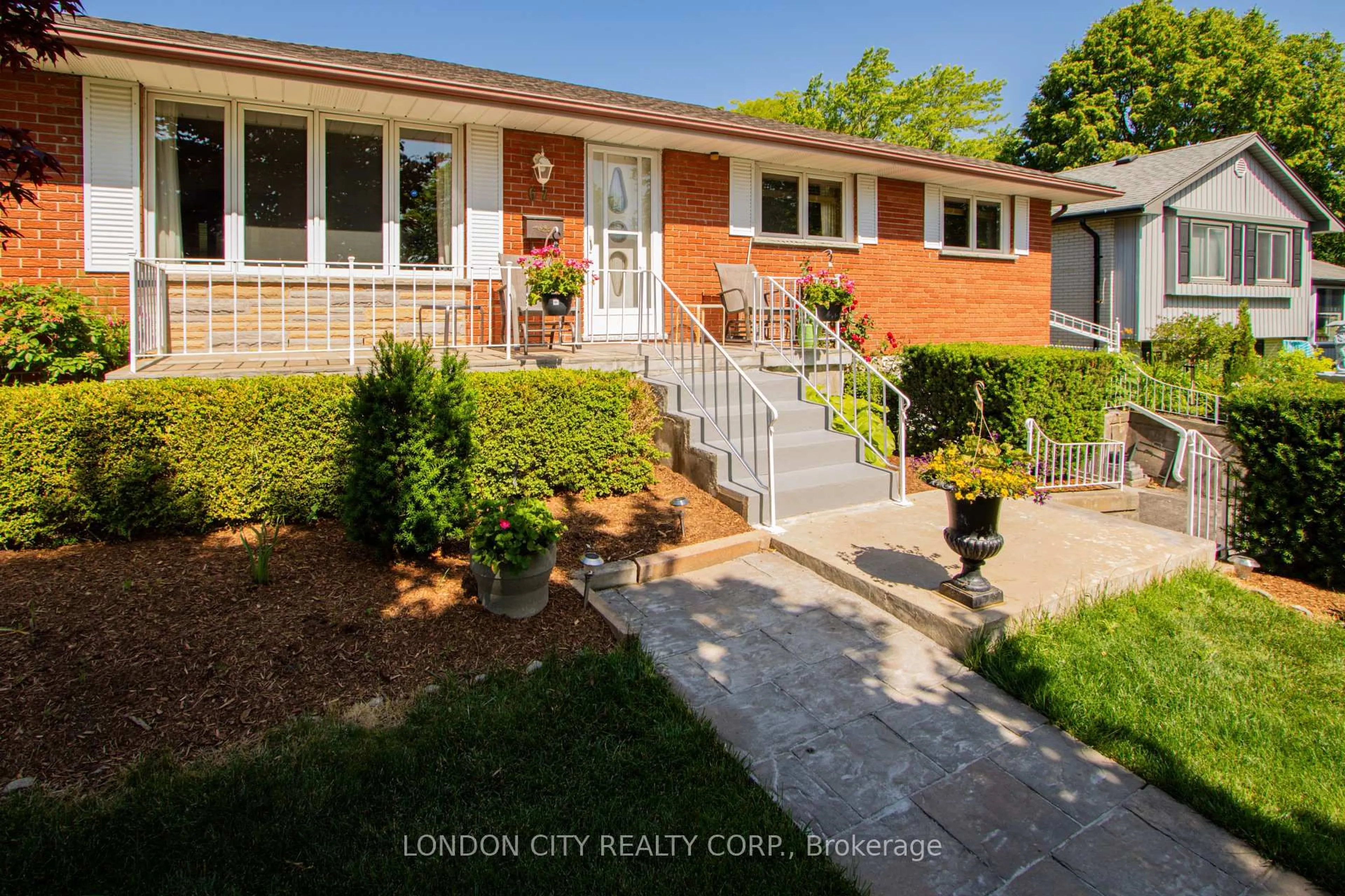 Home with brick exterior material, street for 67 Almond Road. N5Z 4C7 Rd, London South Ontario N5Z 4C7