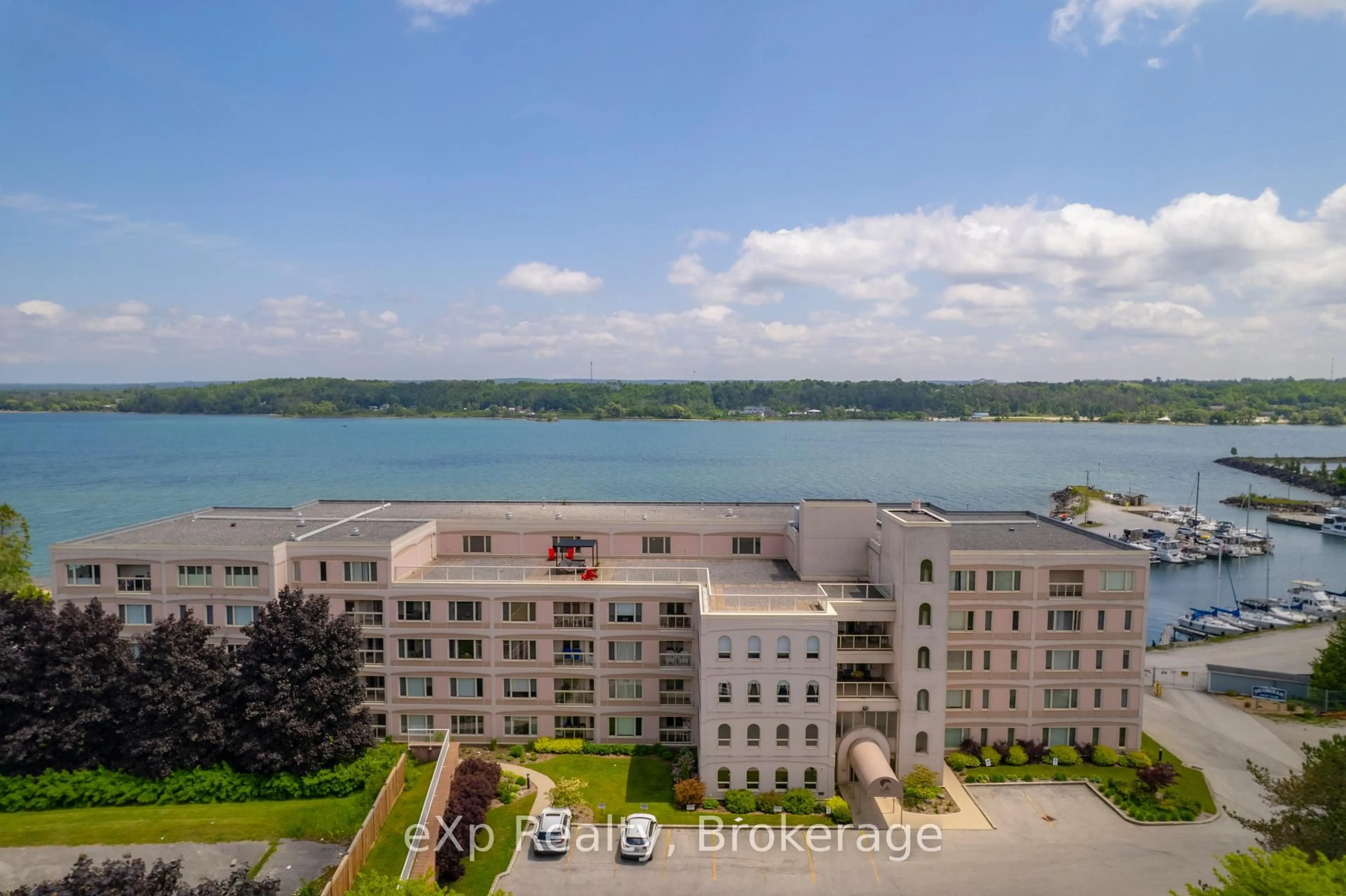 A pic from outside/outdoor area/front of a property/back of a property/a pic from drone, water/lake/river/ocean view for 2555 3rd Ave #309, Georgian Bluffs Ontario N4K 6T8